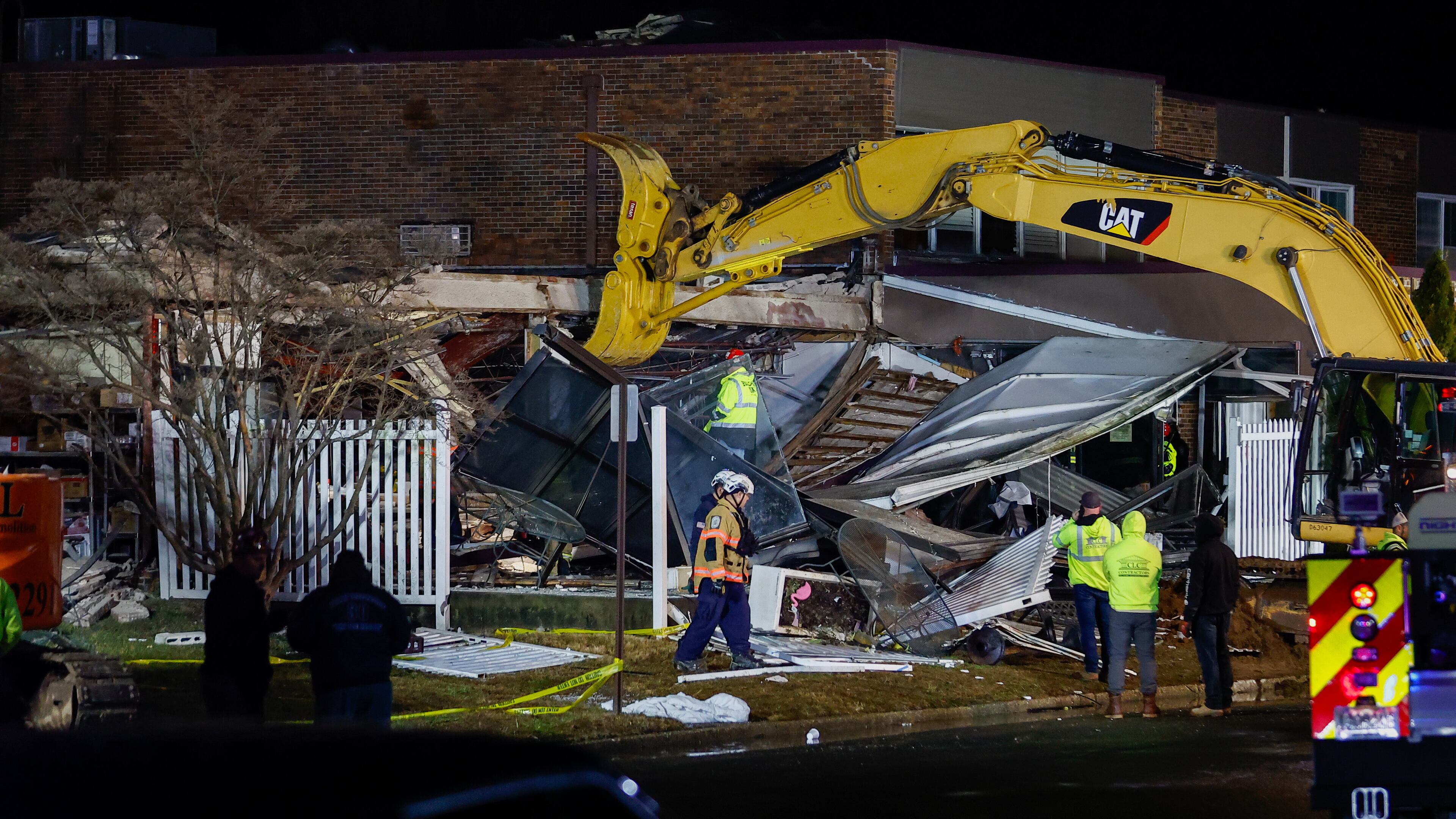First responders work at the scene of an explosion and fire at Bristol Health & Rehab Center, Tuesday, Dec. 23, 2025, in Bristol, Pa. (Monica Herndon/The Philadelphia Inquirer via AP)
