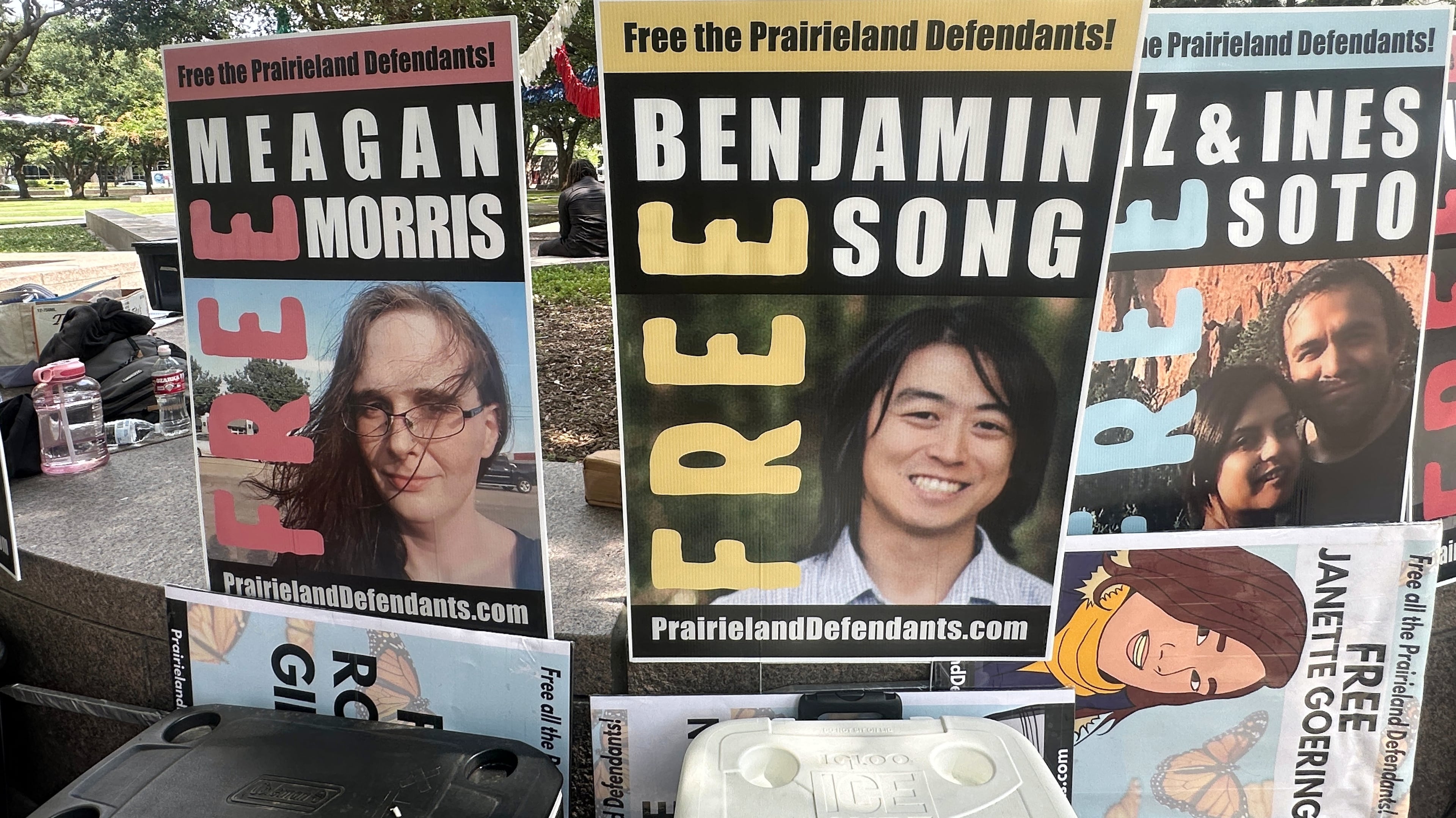 Supporters of protesters convicted over a shooting outside a Texas immigration detention center display signs in support of the defendants outside a federal courthouse in Fort Worth, Texas on Tuesday, June 23, 2026. (AP Photo/Kendria LaFleur)