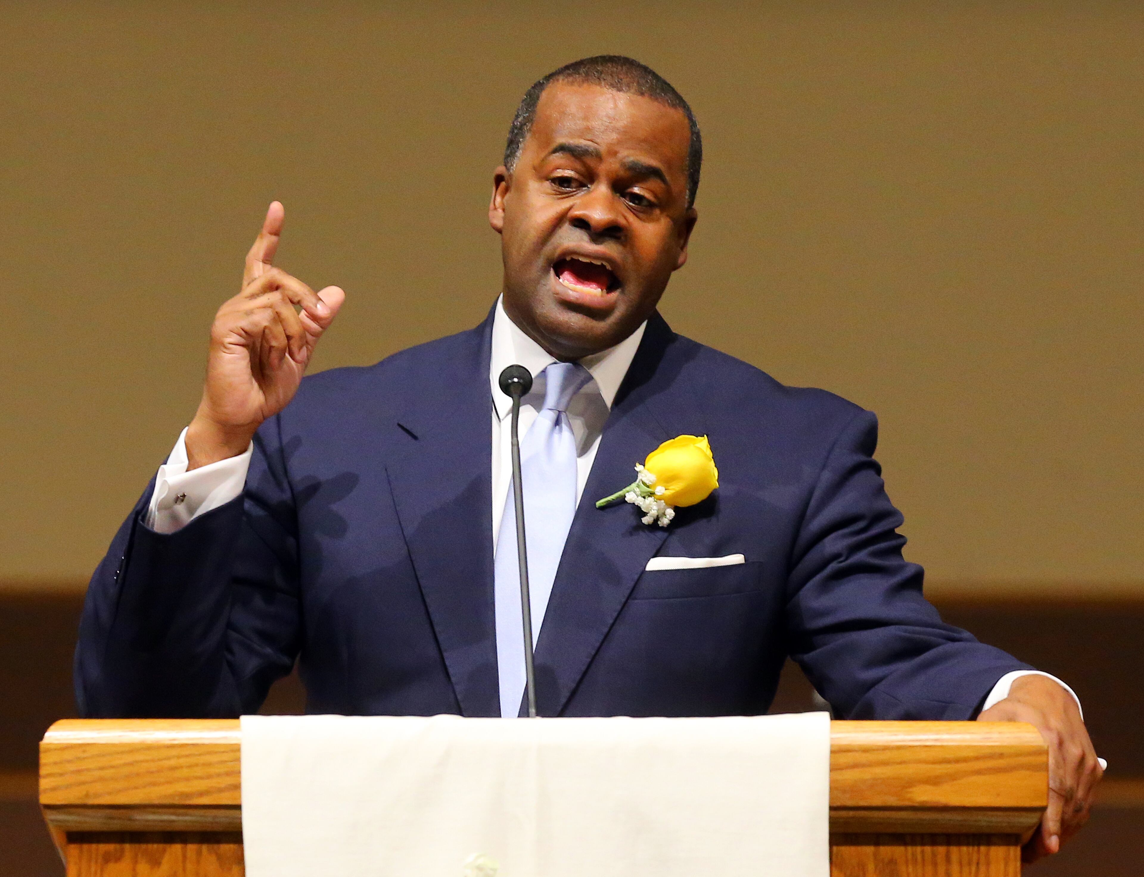 Atlanta Mayor Kasim Reed delivers his reflections during the inaugural interfaith worship service celebrating his second term at Cascade United Methodist Church on Sunday, Jan. 5, 2014, in Atlanta. Blue is the mayor's favorite color, one that we see often in his wardrobe. (We like the yellow rose for accent.)