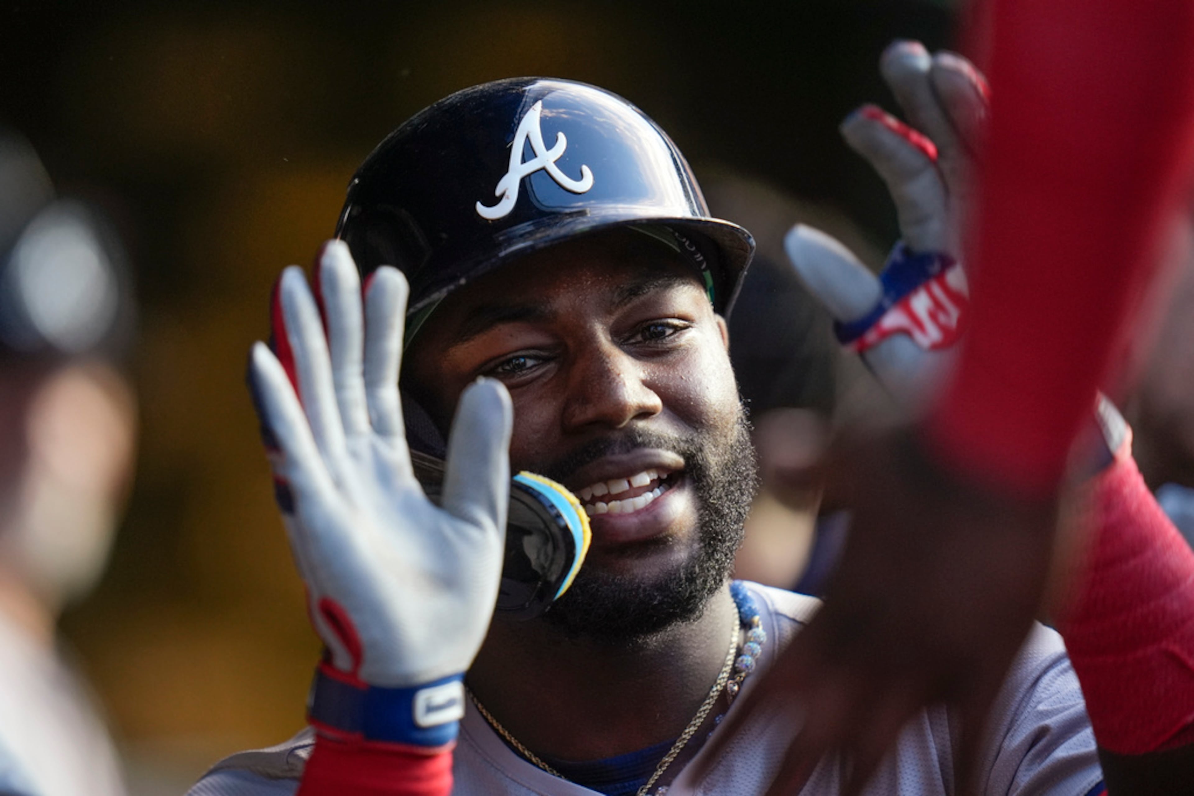 Atlanta Braves' Michael Harris II celebrates in the dugout after hitting a home run against the Chicago Cubs during the fourth inning of a baseball game Tuesday, May 21, 2024, in Chicago. (AP Photo/Erin Hooley)