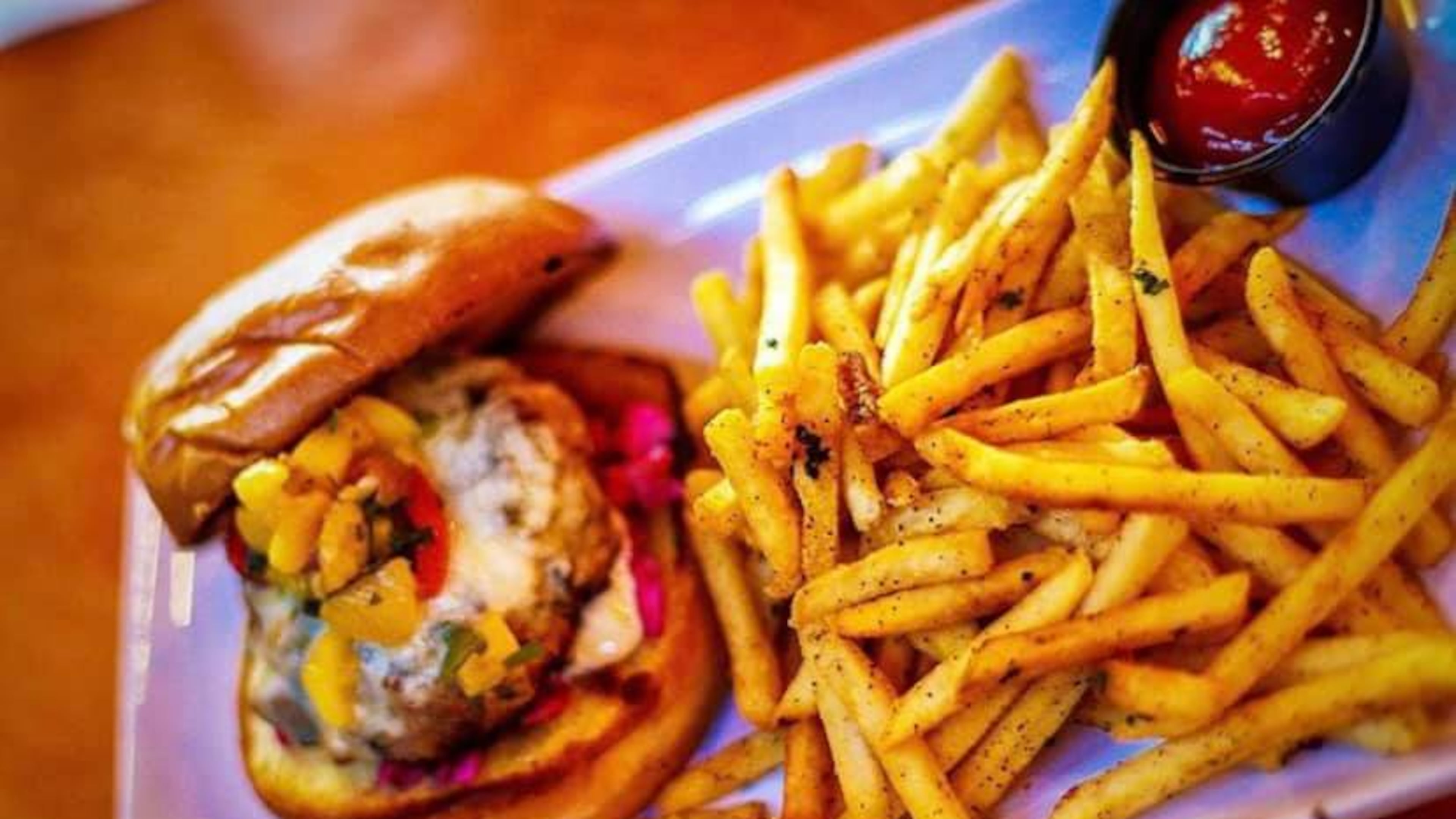 Jerk Turkey Burger and French fries at Fin & Feathers.