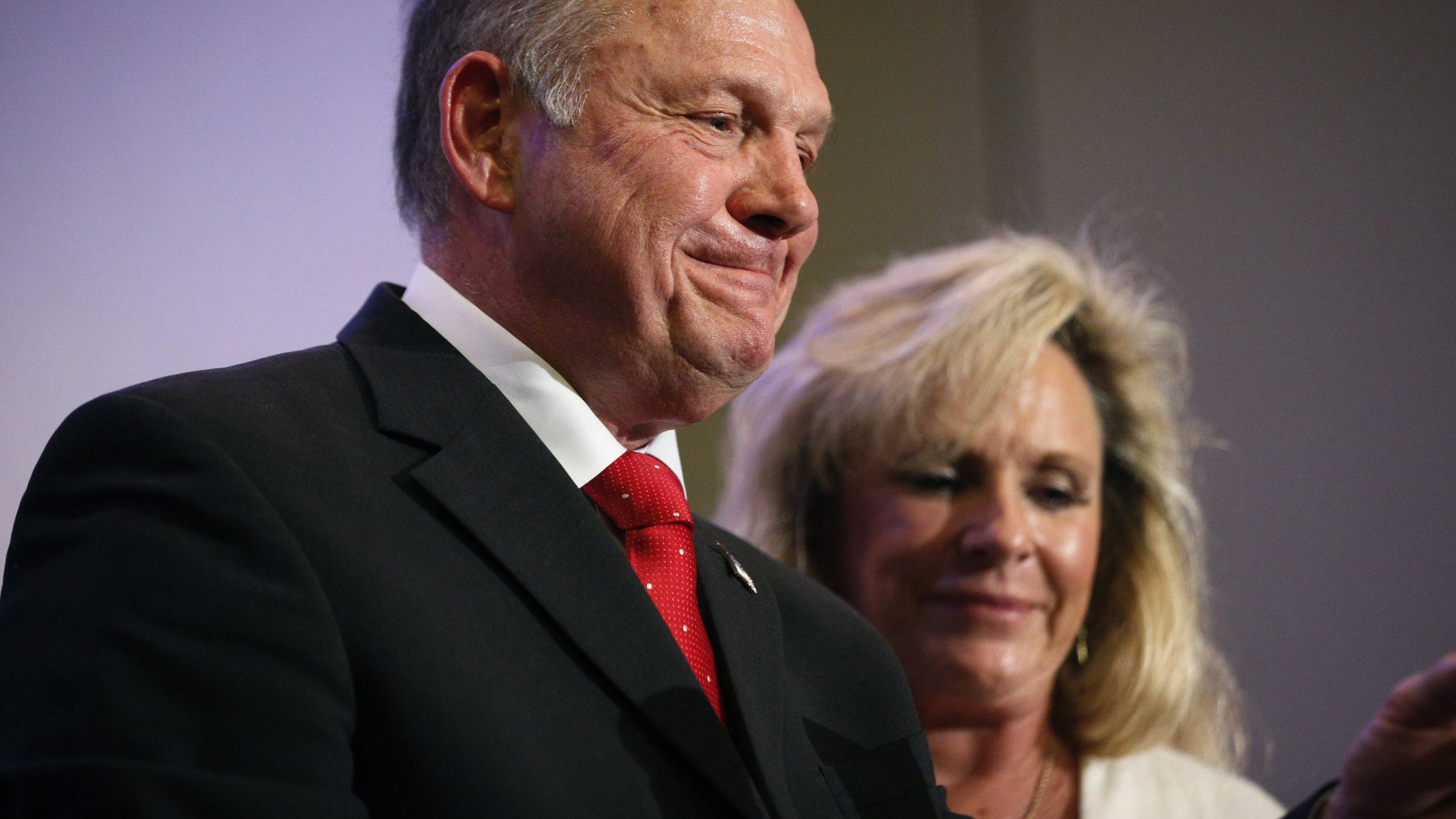 U.S. Senate candidate Roy Moore, a former chief justice of Alabama’s Supreme Court, speaks at a news conference Thursday in Birmingham, Ala., with his wife, Kayla Moore, at his side. (AP Photo/Brynn Anderson)