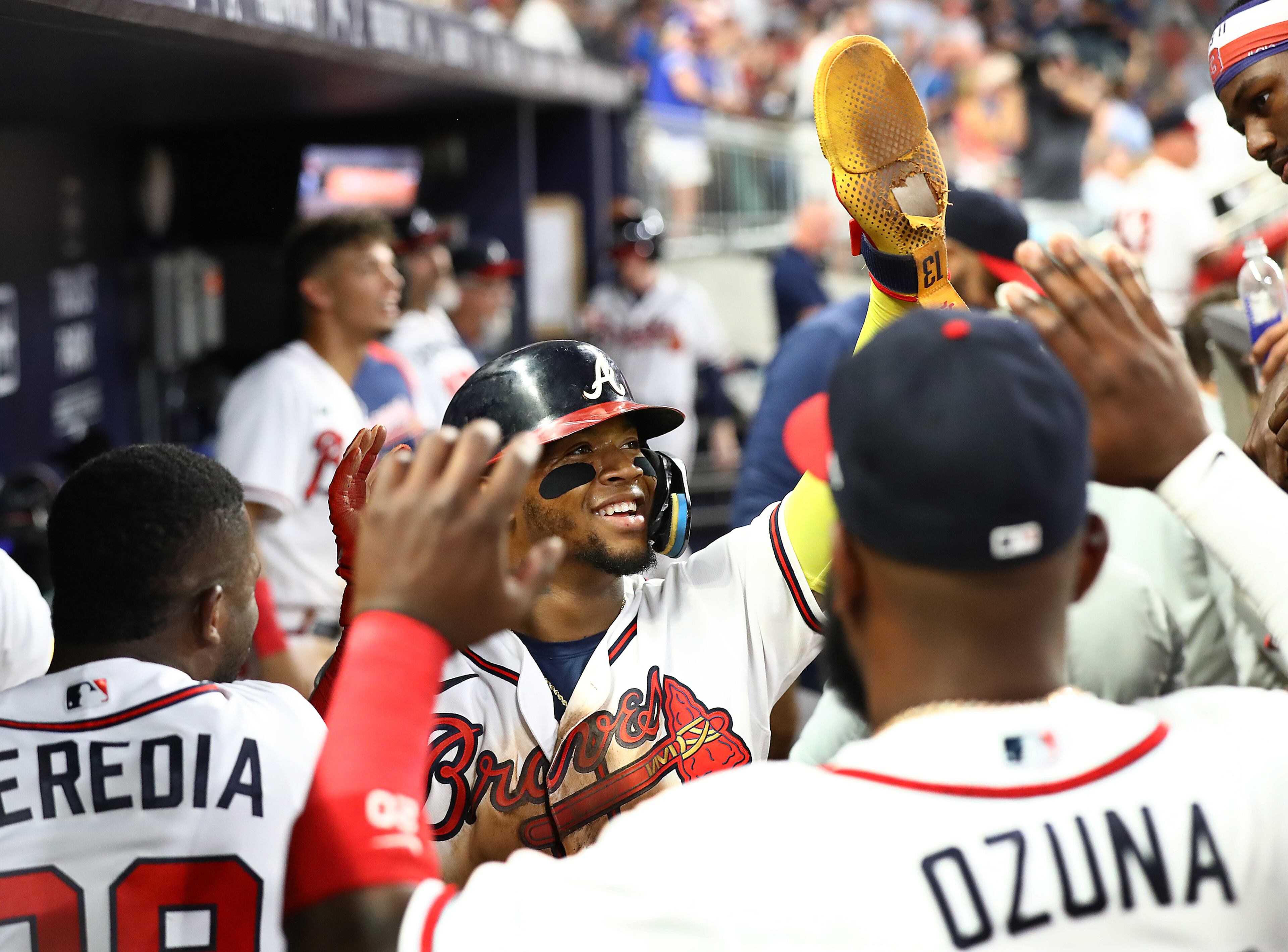 Braves outfielder Ronald Acuna celebrates with teammates in the dugout during a 5-0 shutout of the New York Mets after scoring on a Dansby Swanson RBI-single during the seventh inning in a MLB baseball game on Tuesday, August 16, 2022, in Atlanta. “Curtis Compton / Curtis Compton@ajc.com