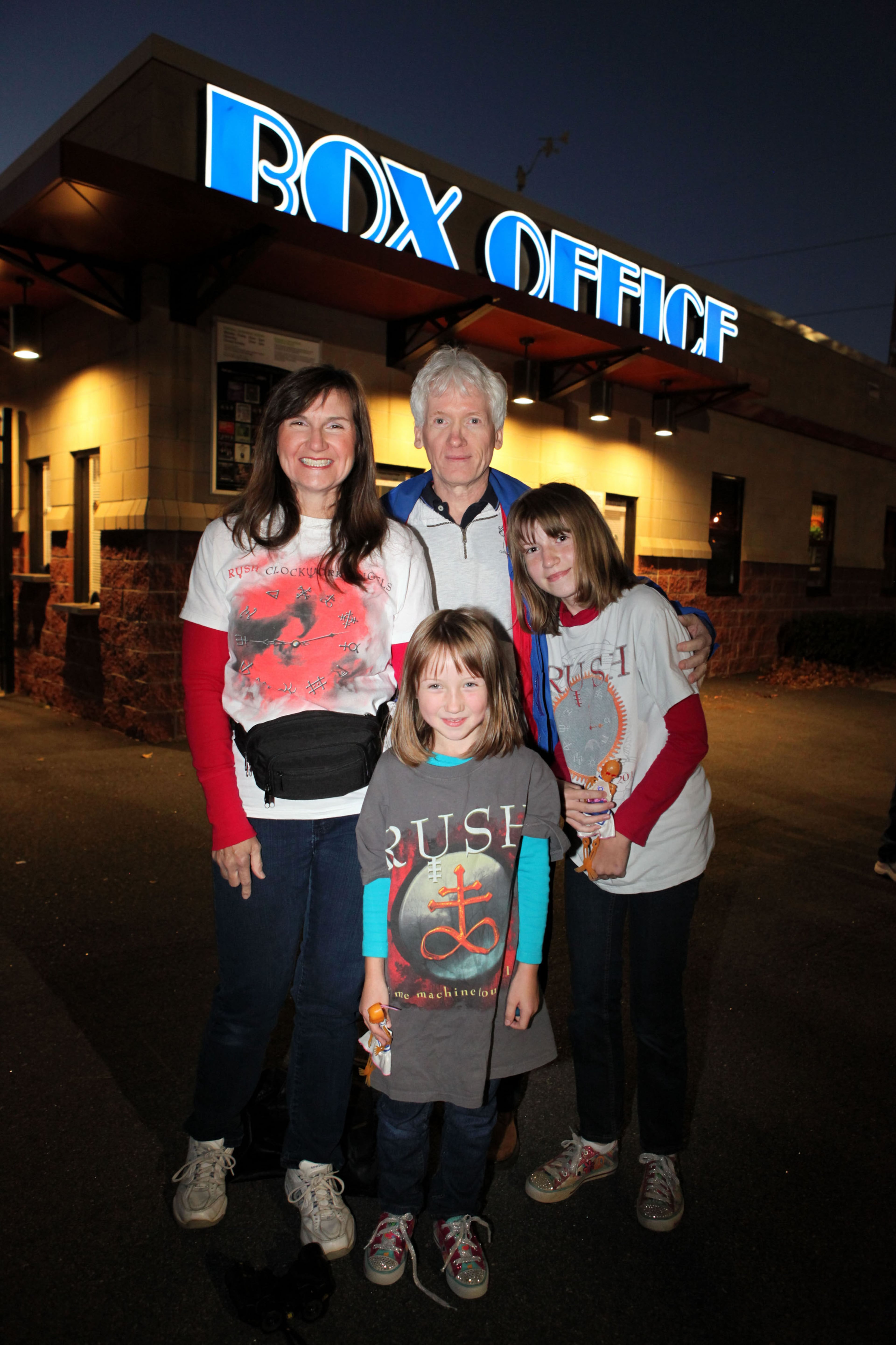 Mom Janet, Erin (age 7), Anna (age 12) and Dennis Schwarz drove in from Marietta for a family night at the Rush concert.