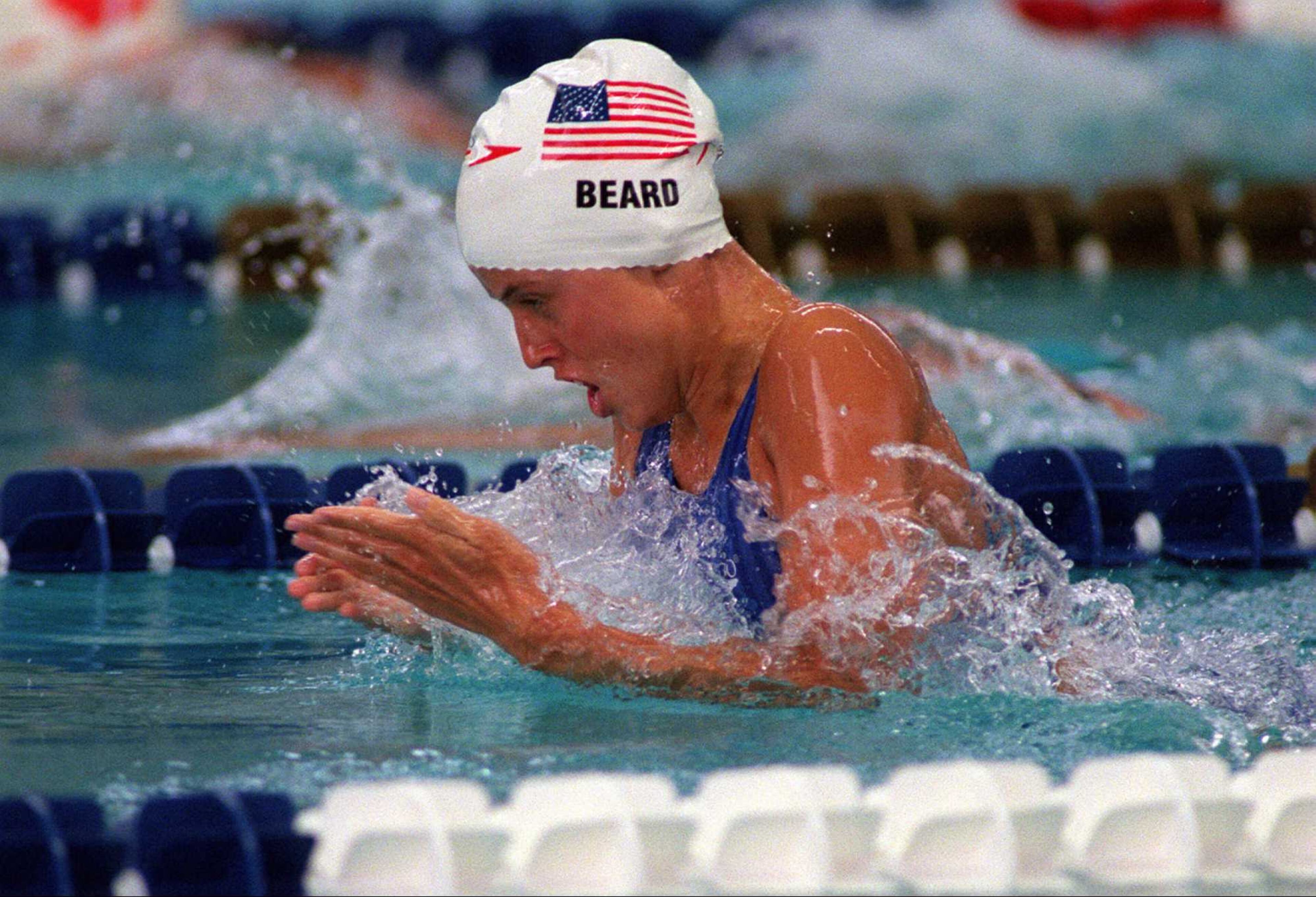 Amanda Beard of the U.S. women's swim team competes in a 100-meter breastroke. (Cox Staff Photo/Allen Eyestone)