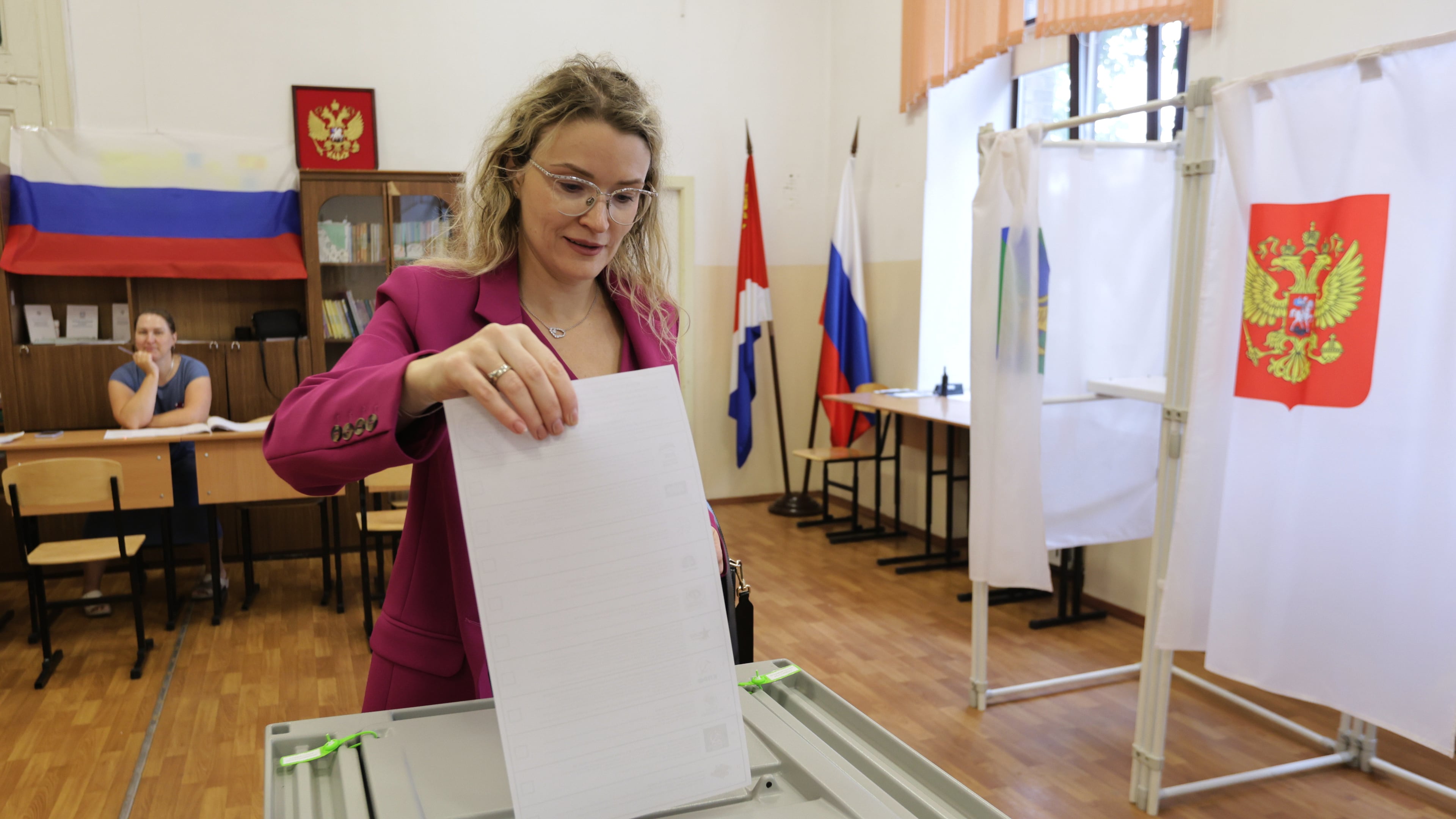 A woman casts her ballot in the parliamentary election in Vladivostok, Russia, Friday, Sept. 18, 2026. (AP Photo)