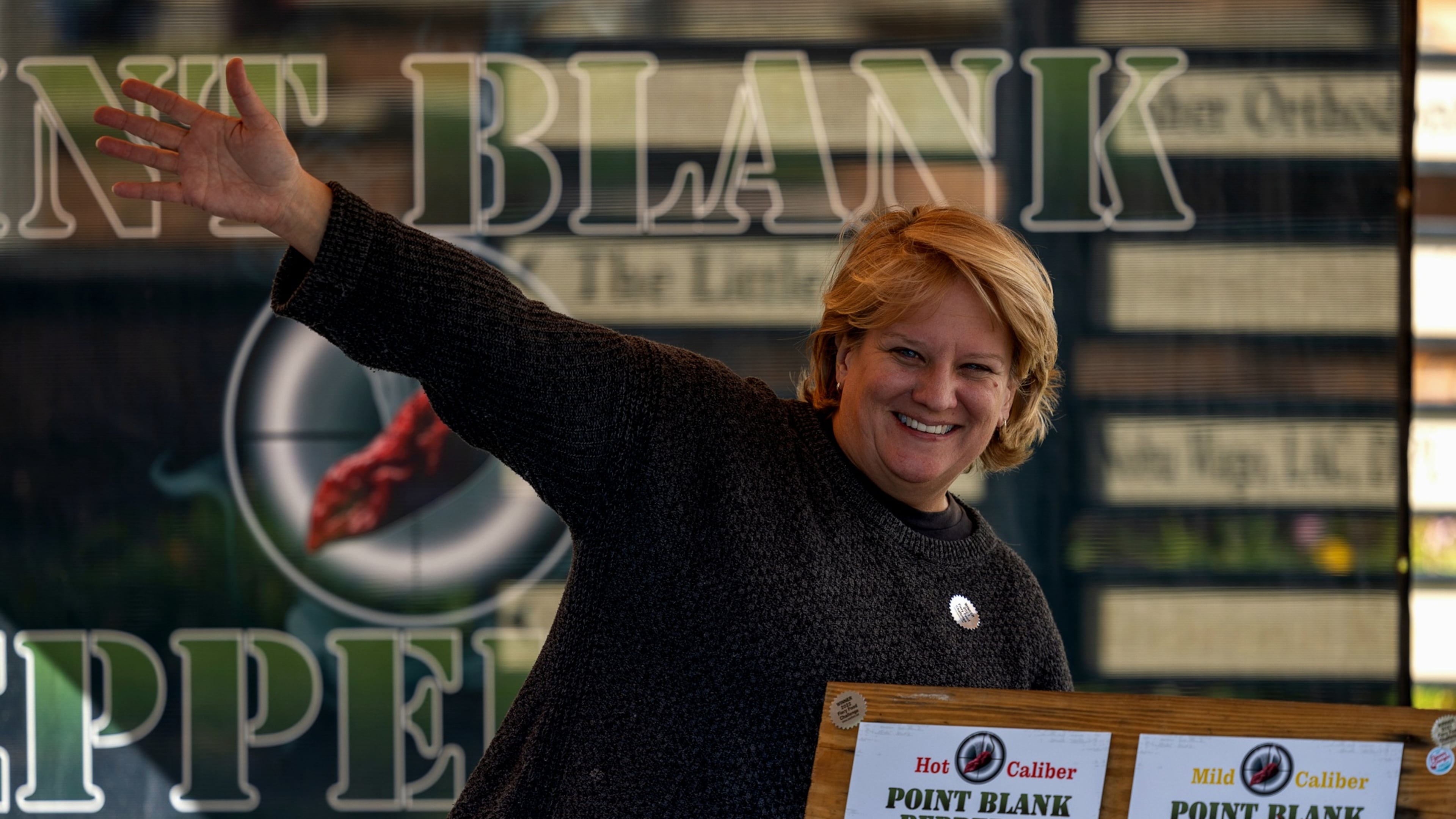 Mindy Newton helps her husband, Rich Newton, produce their pickled peppers and loves talking with customers when they exhibit at farmers markets and festivals. (Courtesy of Point Blank Pepper Co.)