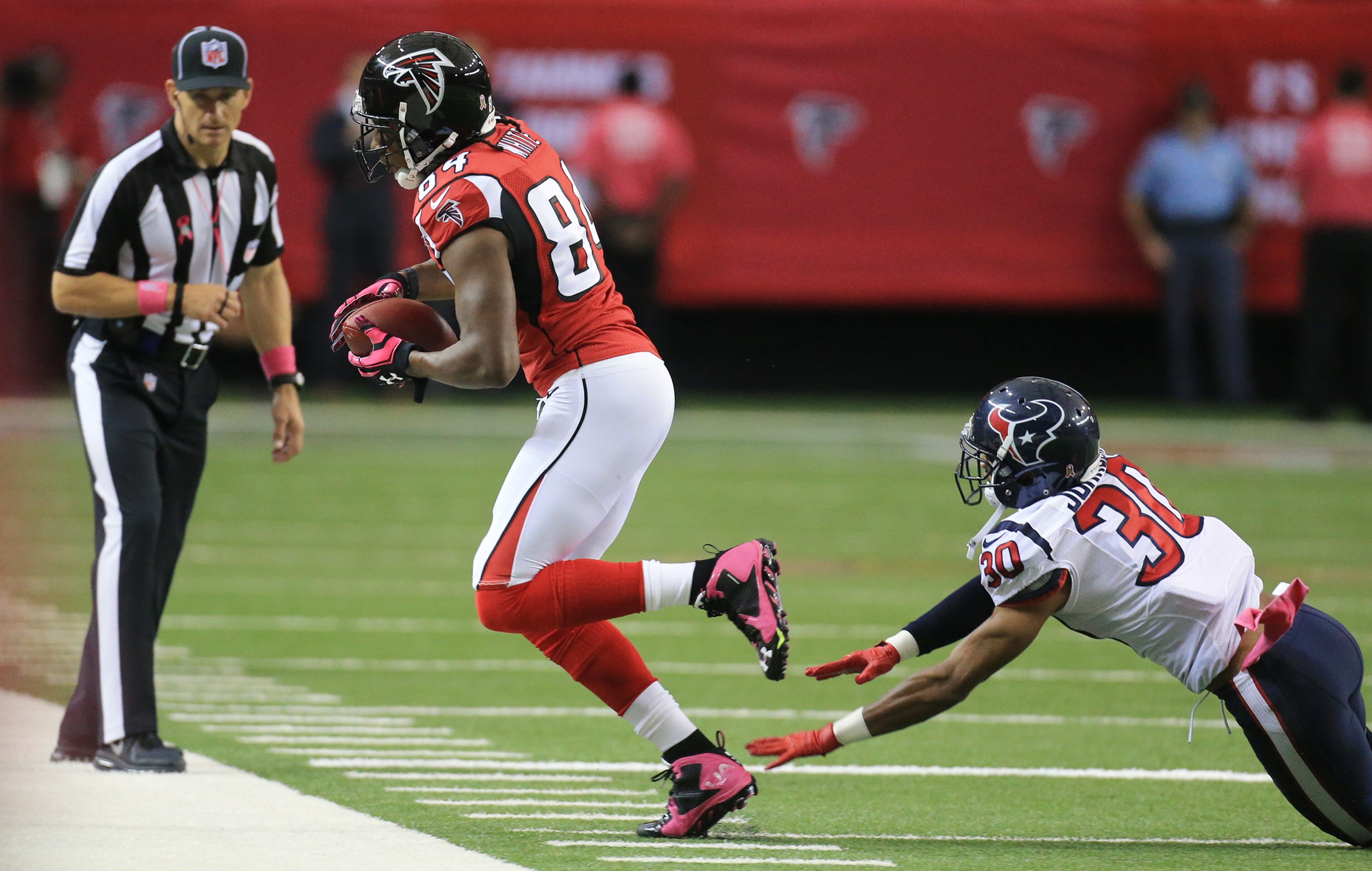 Falcons wide receiver Roddy White makes a reception against Texans Kevin Johnson during the first half in a football game on Sunday, Oct. 4, 2015, in Atlanta.