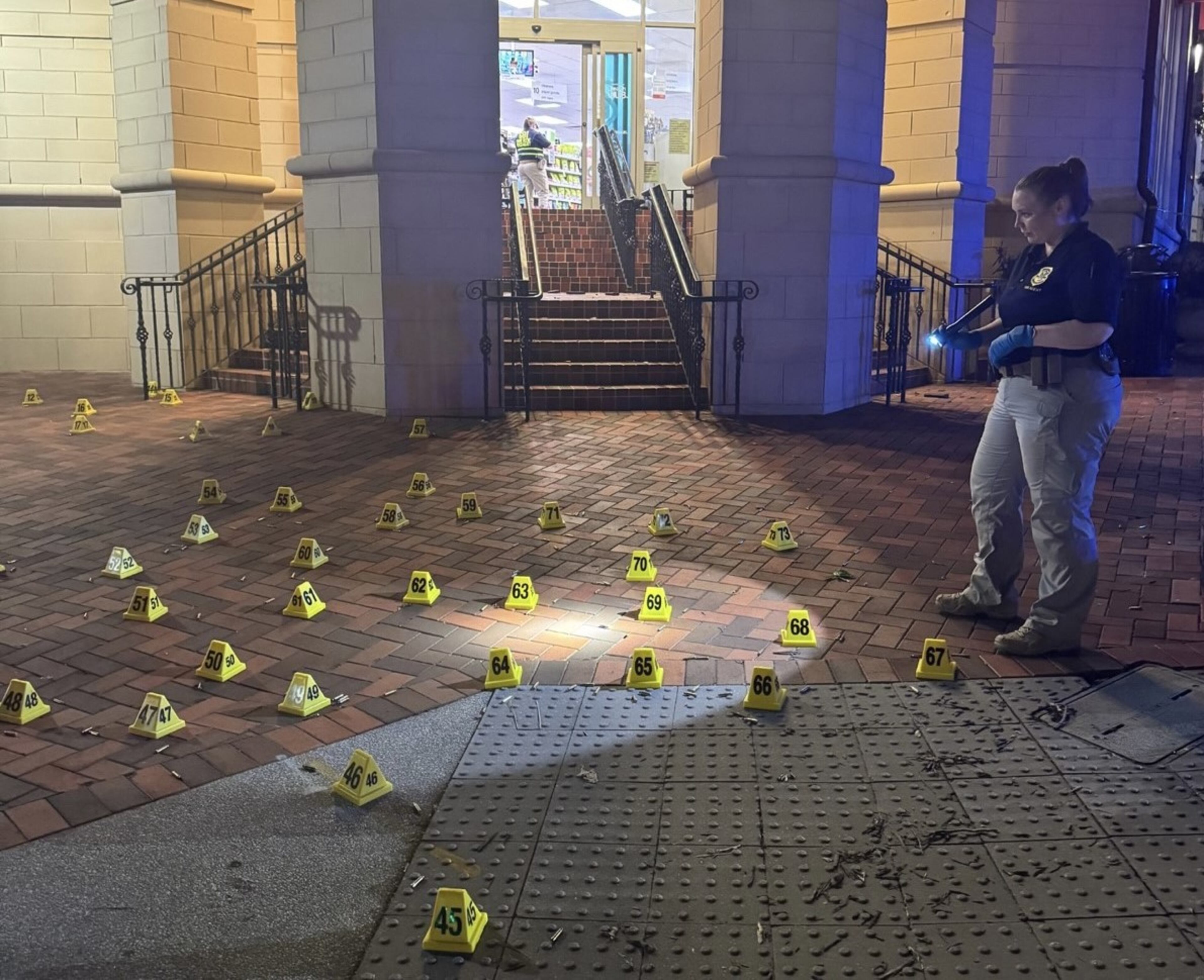 GBI investigators document the shell casings found in front of a CVS pharmacy, where a man opened fire on the Centers for Disease Control and Prevention on Aug. 10. (Courtesy of the GBI)