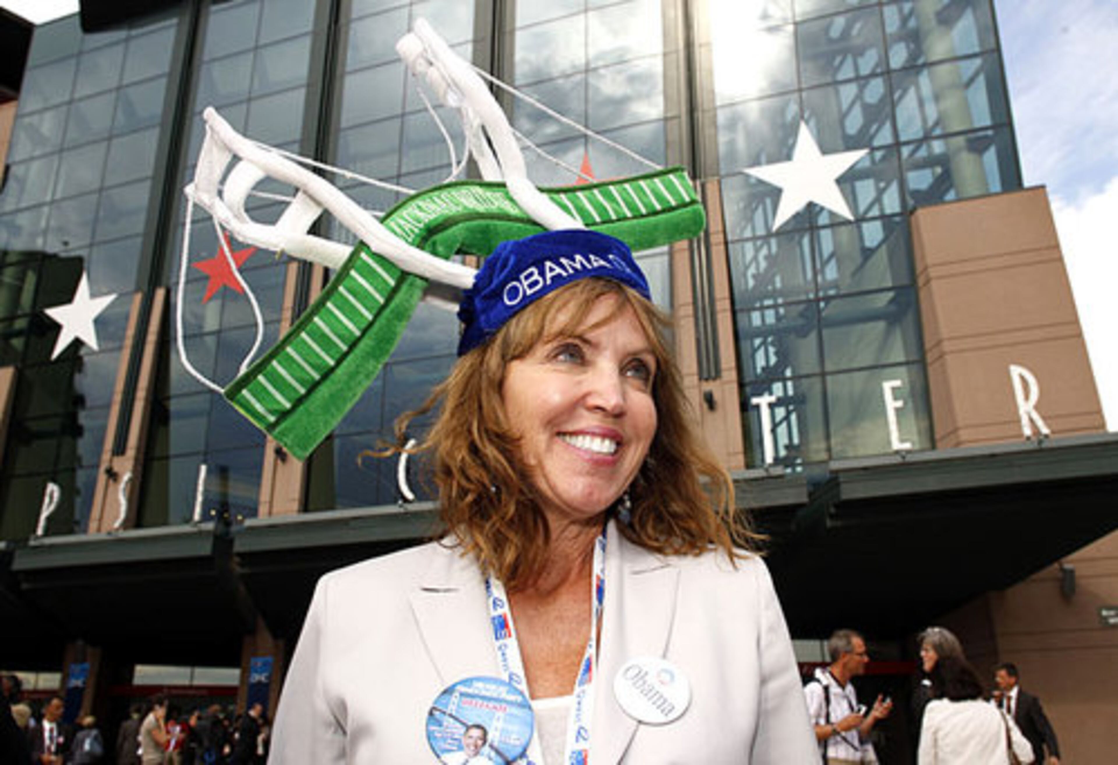Delegate Abby Dart of Harbor Springs, Mich., shows off her hat outside of the Pepsi Center in Denver. Dart had a friend take a blue "Obama '08" hat and attach a green-and-white Mackinac Bridge to it. She said the hat was to remind conventioneers that tourism is the state's No. 2 industry, behind automobiles. "I'm doing it to highlight the beauty of Michigan," she said.