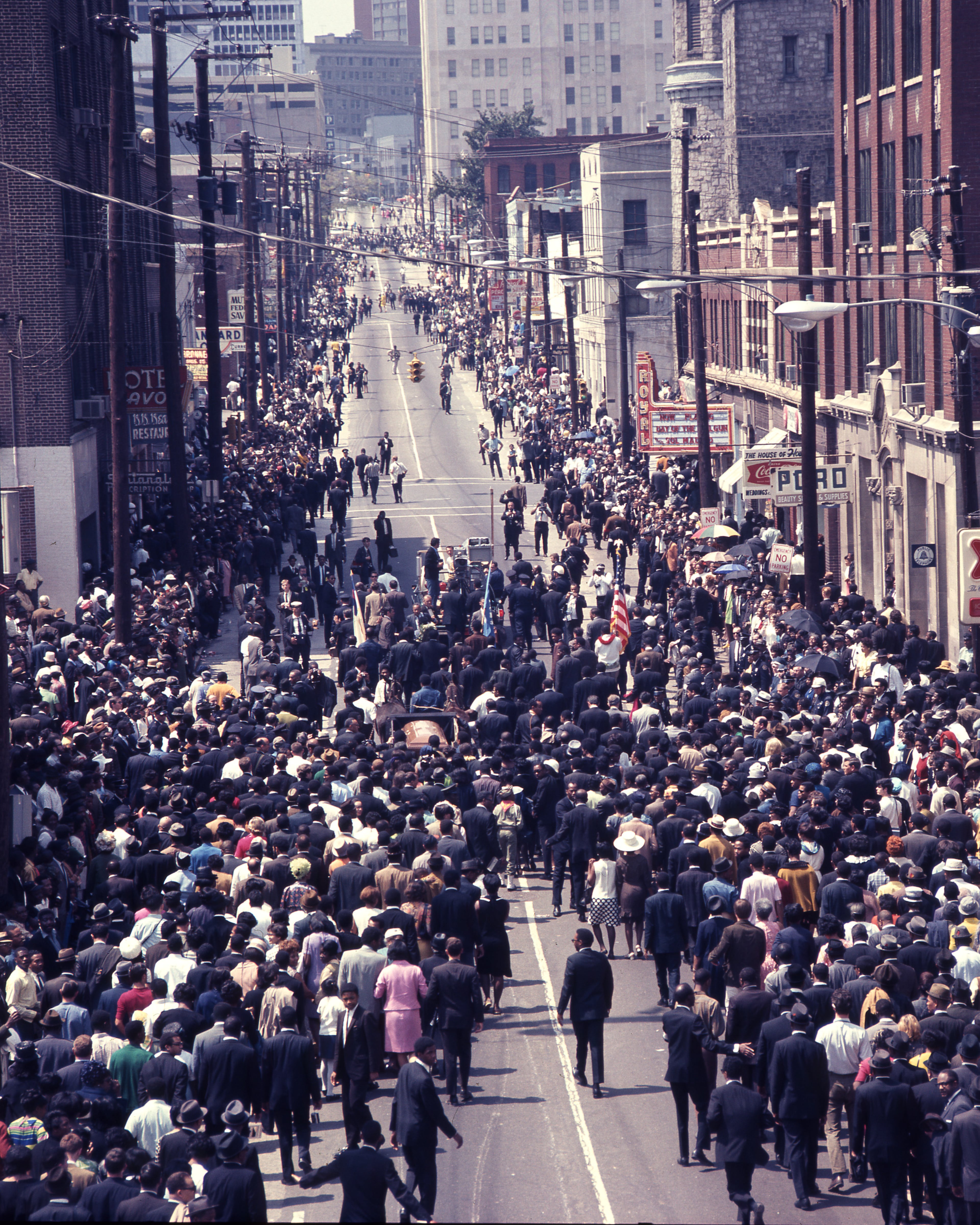 The funeral procession for Dr. Martin Luther King, Jr. makes its way down Auburn Avenue in 1968. King died from an assassin's bullet while in Memphis to support a garbage workers strike. Photo: Kenan Research Center at the Atlanta History Center.