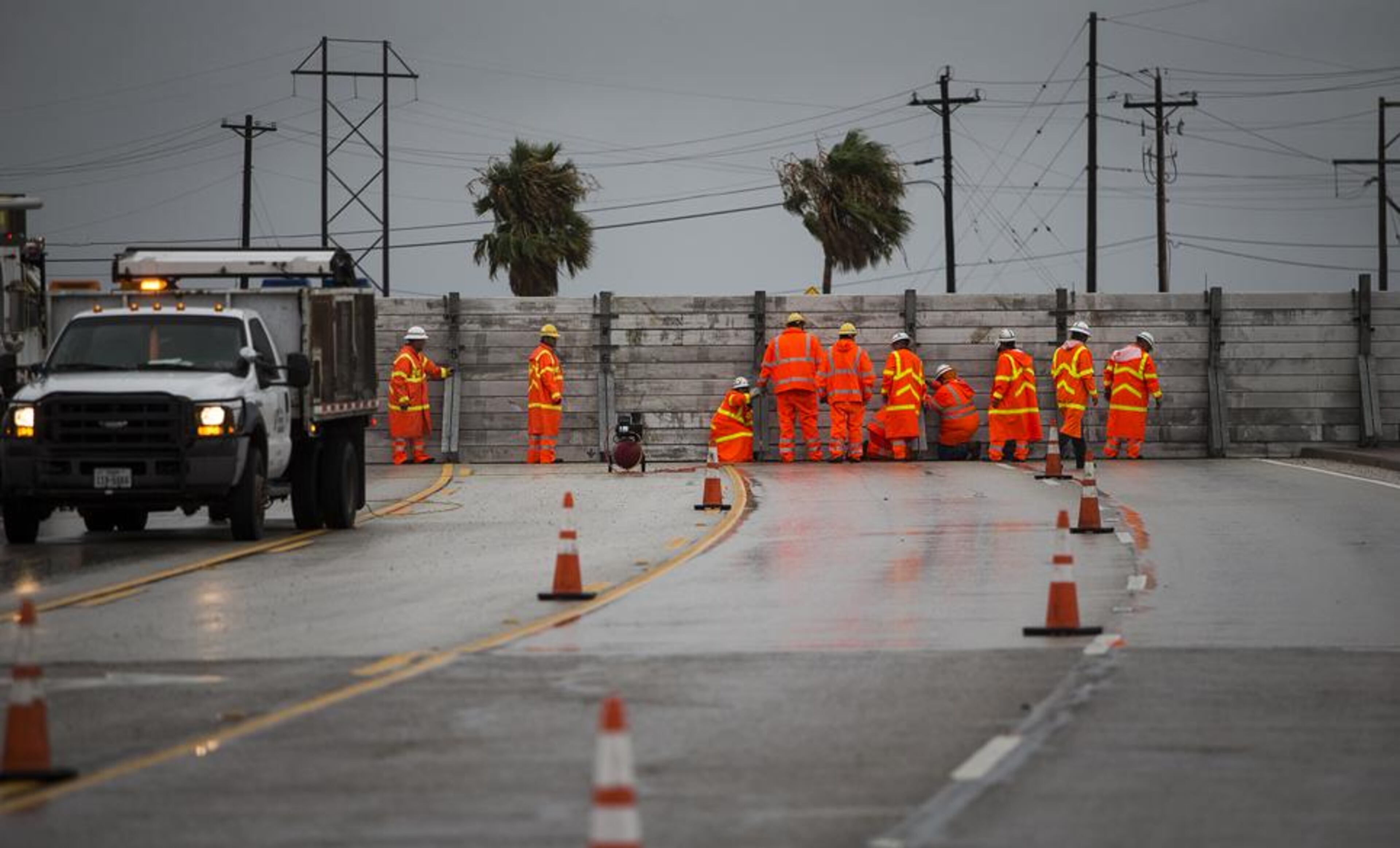 TxDOT crews install the final portion of a surge wall on TX-361 leading to the Port Aransas ferry in Aransas Pass, Texas, on Friday, August 25, 2017. Hurricane Harvey is expected to make landfall on the Texas coast tonight or early Saturday morning as a category 3 hurricane.