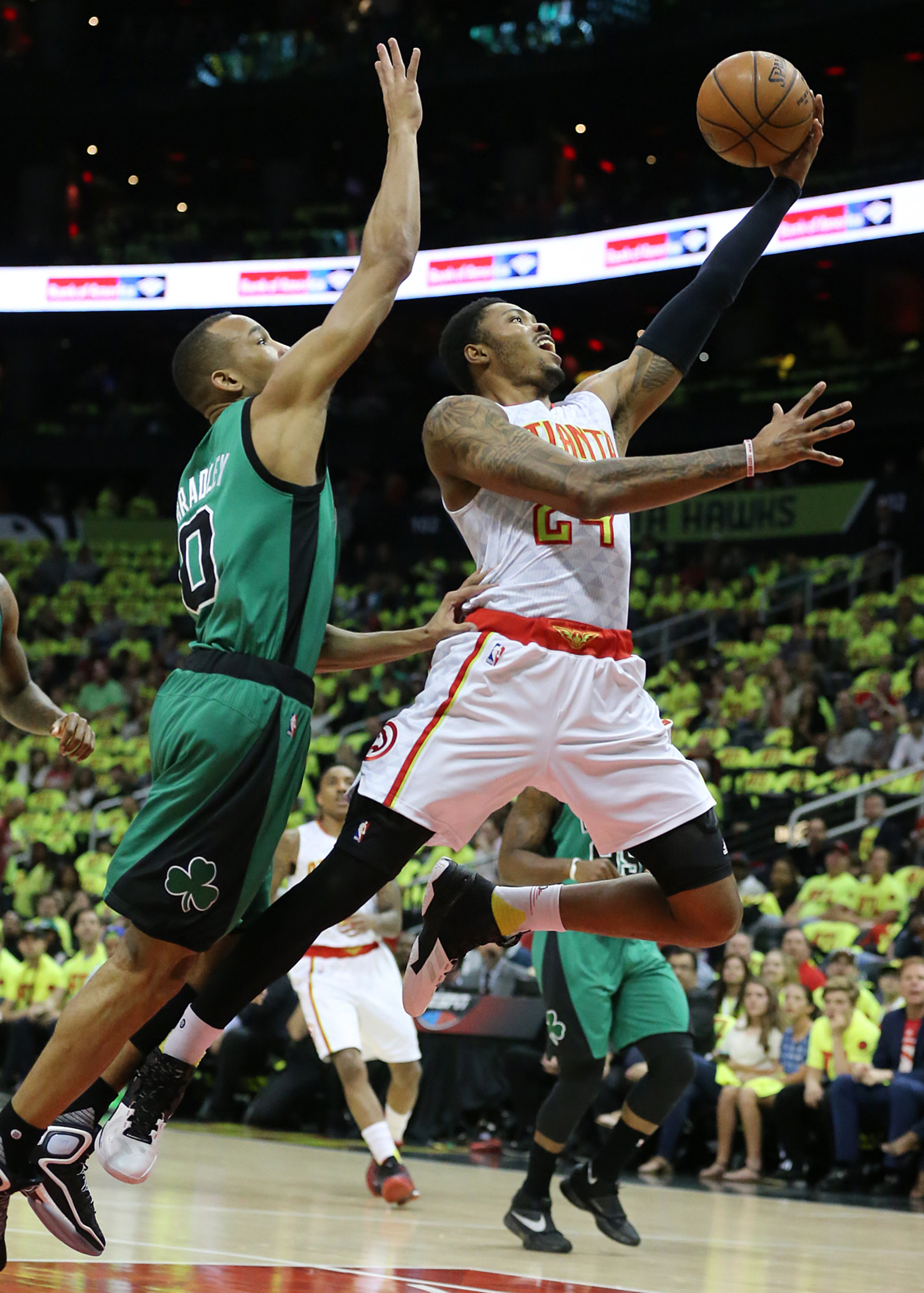 041616 ATLANTA: Hawks Kent Bazemore goes to the basket for two points past Celtics Avery Bradley in their NBA Eastern Conference first round playoff game at Philips Arena on Saturday, April 16, 2016. Curtis Compton / ccompton@ajc.com