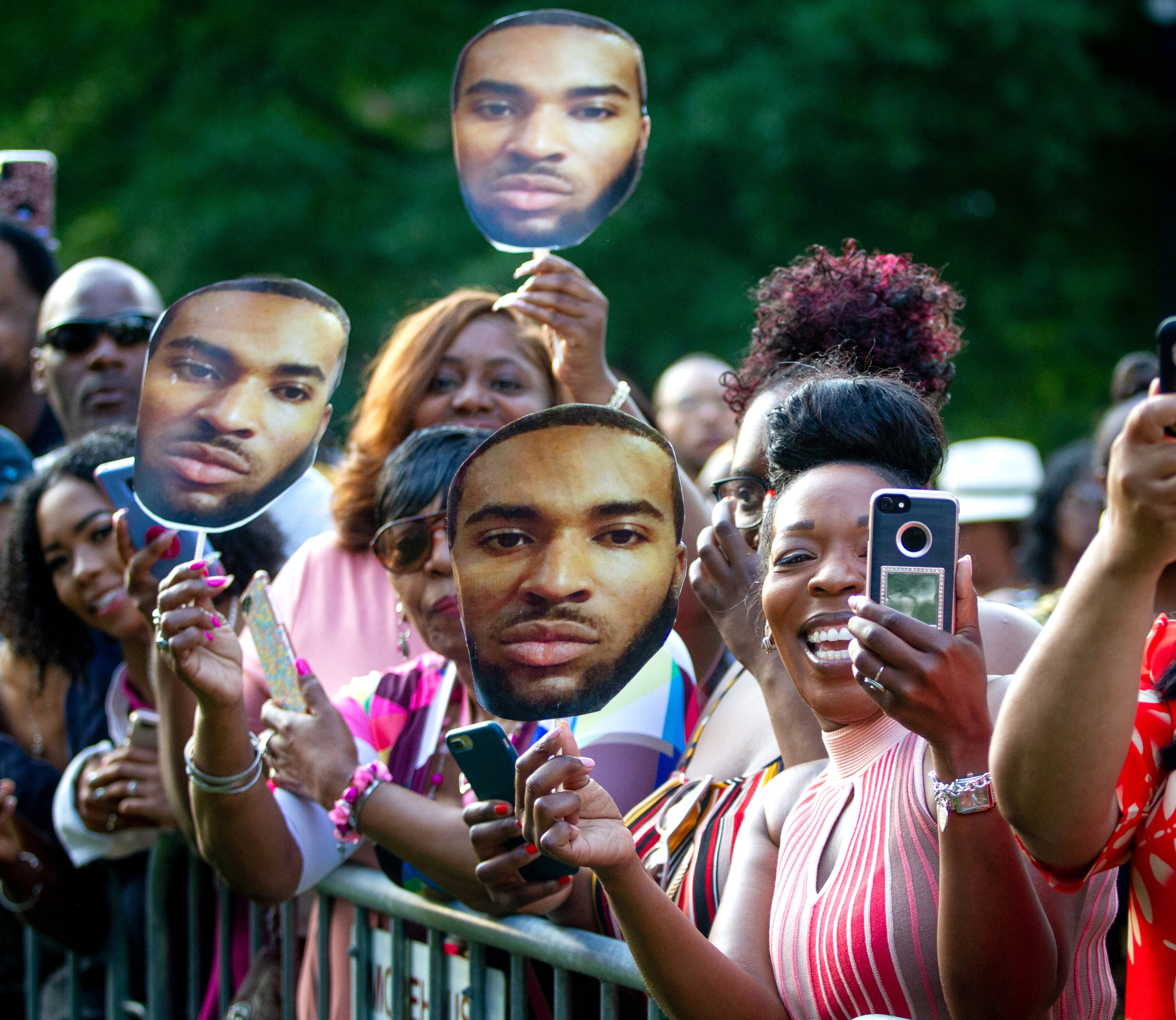 Nicole Bush holds a photo of her son Jesse Woodbury while the graduates walk to the stage at the start of the Morehouse College graduation ceremony in Atlanta on Sunday, May 19, 2019. STEVE SCHAEFER / SPECIAL TO THE AJC