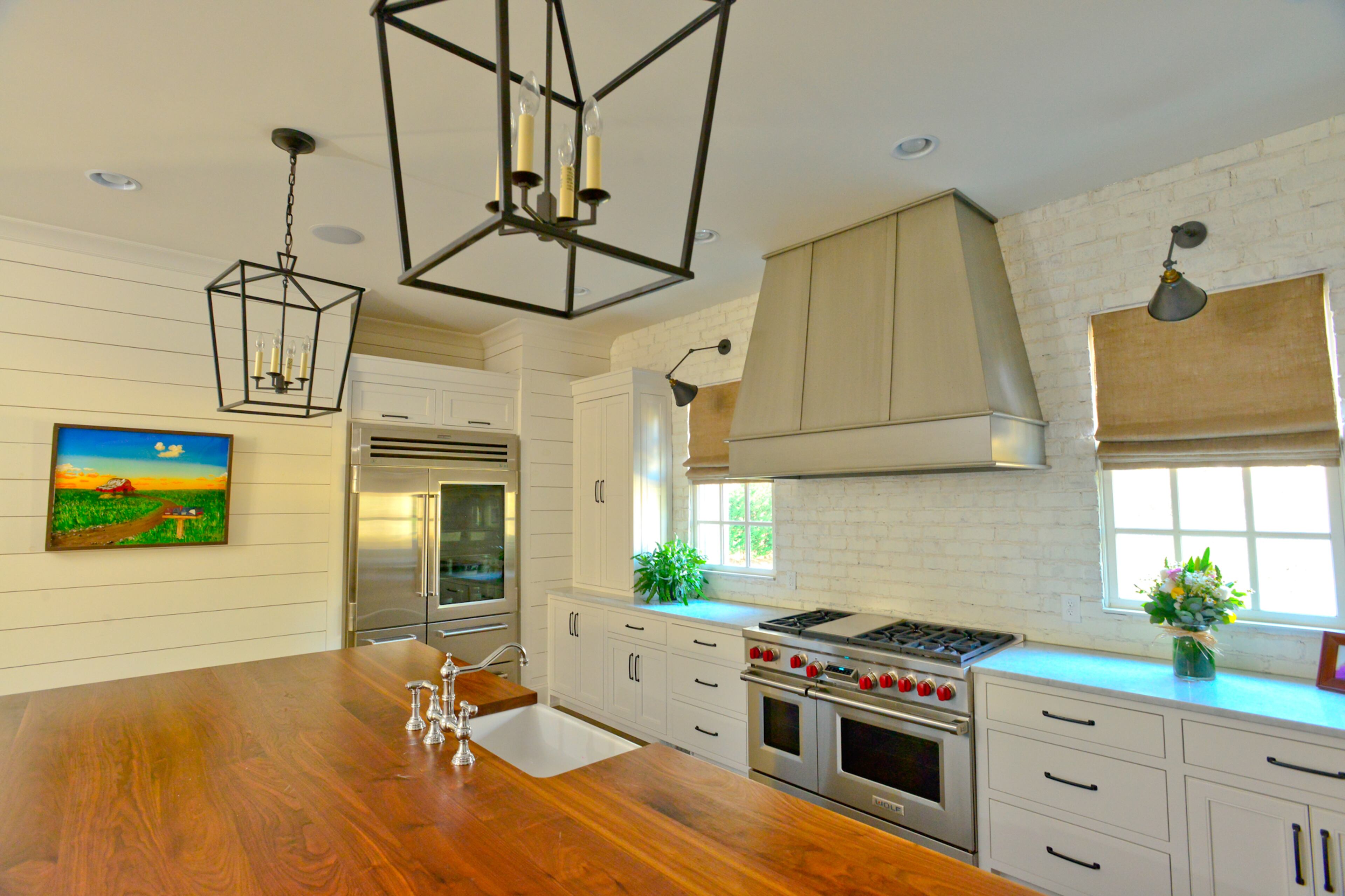 Everything in the kitchen is painted Sherwin-Williams Alabaster white, including the real brick backsplash. Homeowners Randy and Casey Schiltz were inspired to do the backsplash after they saw old Charleston farmhouses with brick walls. Text by Lori Johnston and Keith Still/Fast Copy News Service. (Christopher Oquendo Photography/www.ophotography.com)