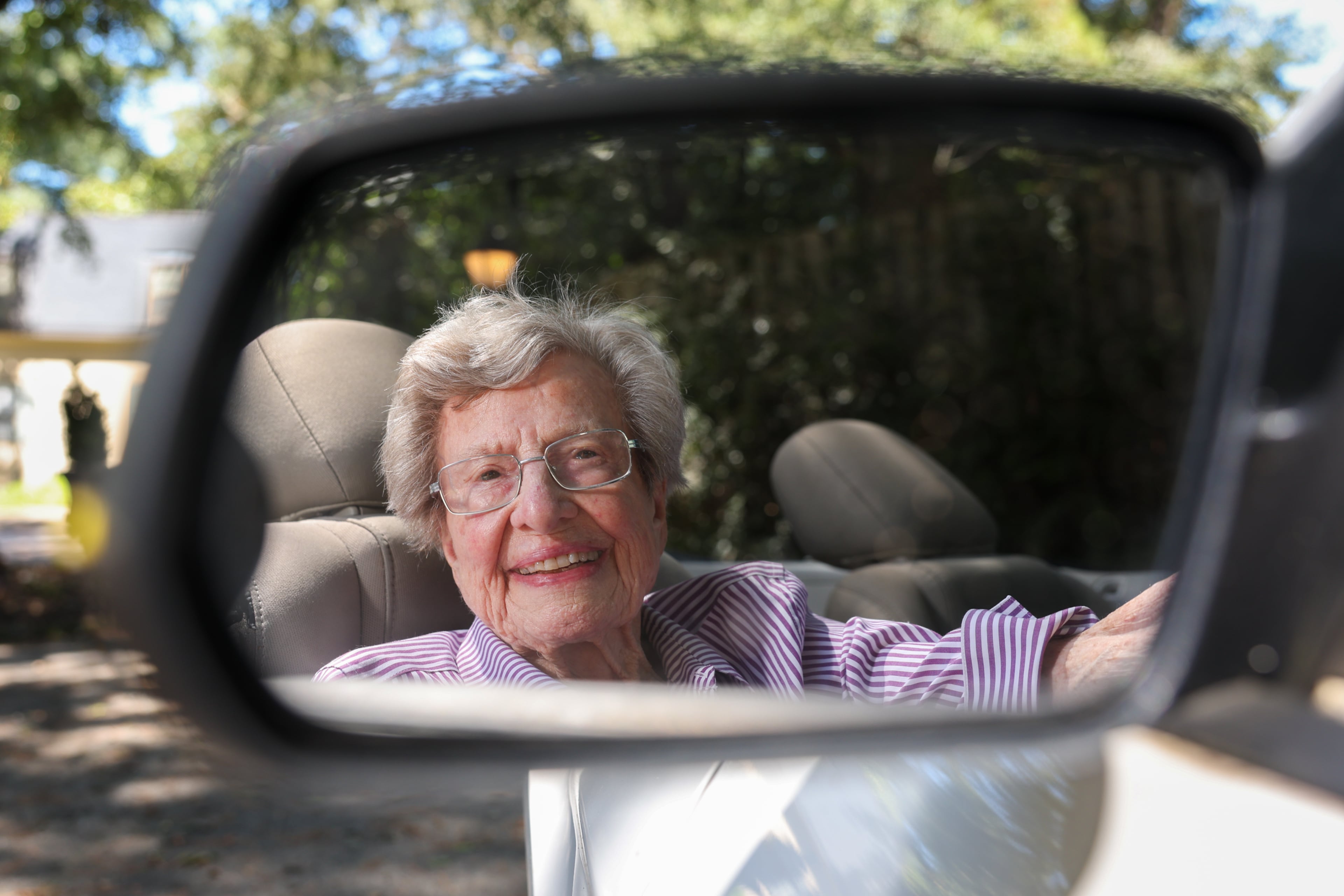 Barbara Haig, 100, had driven convertibles for decades but a few years ago switched to a less sport auto. She said about why she recently got a Ford Mustang: “I’d see other people driving around in convertibles with the top down. And I said, ‘I gotta have another girl.'" (Arvin Temkar/AJC)
