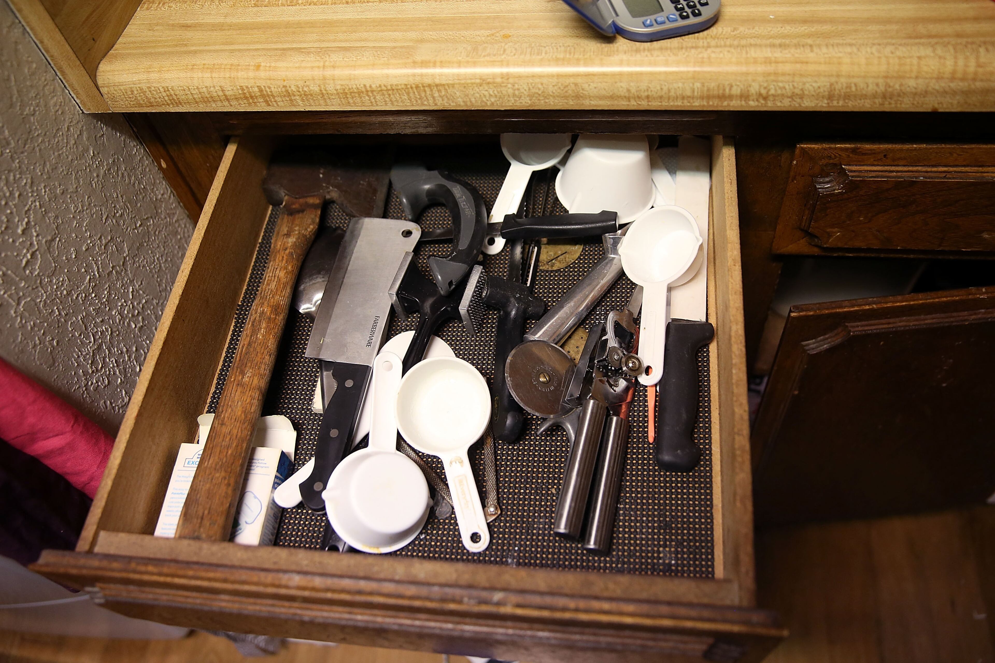 SAN BERNARDINO, CA - DECEMBER 04: A hatchet sits in a kitchen drawer inside the home of shooting suspect Syed Farook on December 4, 2015 in San Bernardino, California. The San Bernardino community is mourning as police continue to investigate a mass shooting at the Inland Regional Center in San Bernardino that left at least 14 people dead and another 21 injured. (Photo by Justin Sullivan/Getty Images)