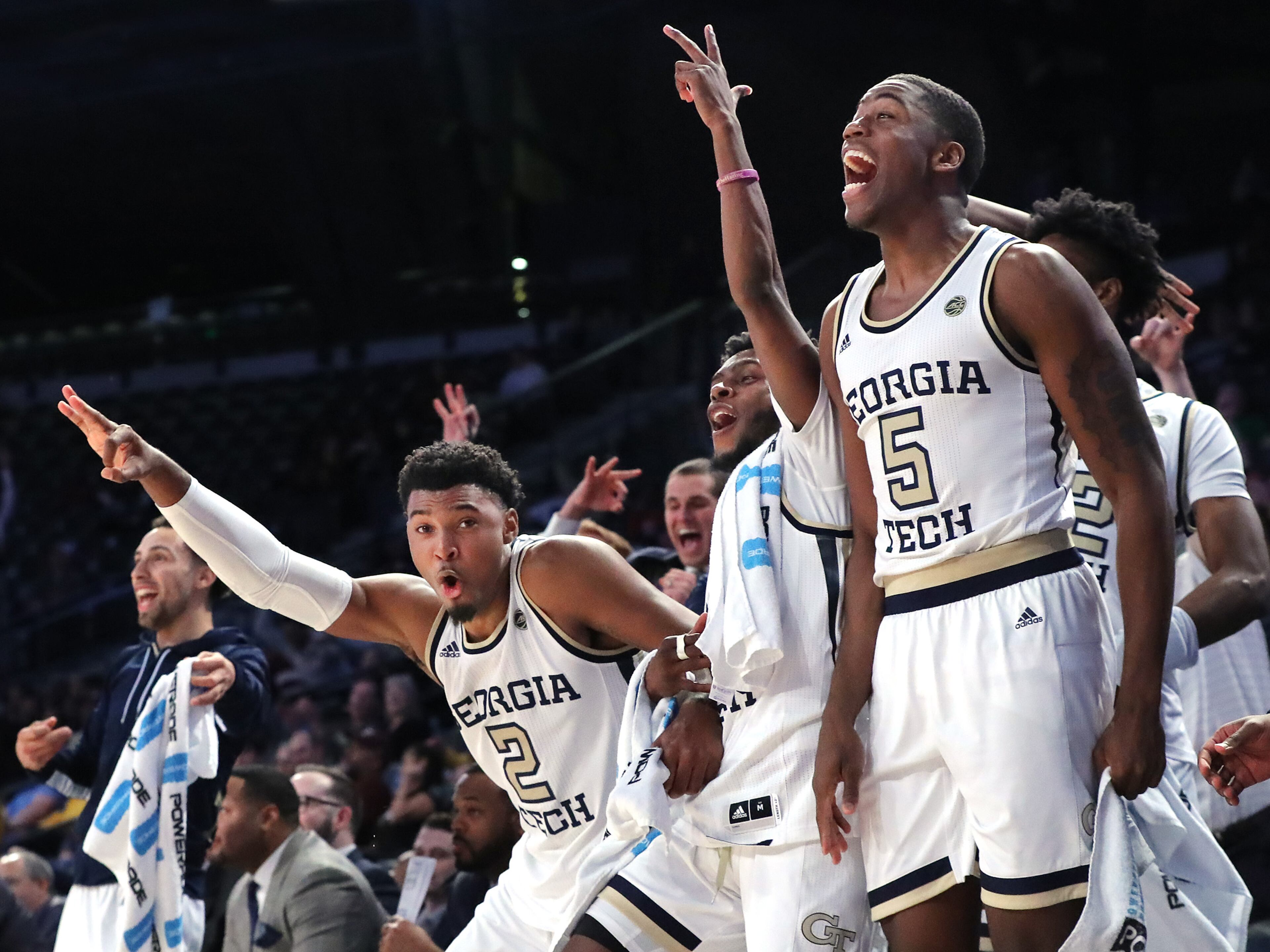 Georgia Tech players Shembari Phillips (left) and Moses Wright (right) react as teammate Niko Broadway makes a reverse layup for a basket in the final minutes of a 82-54 victory over Morehouse in a NCAA college basketball game on Tuesday, January 28, 2020, in Atlanta. Curtis Compton ccompton@ajc.com