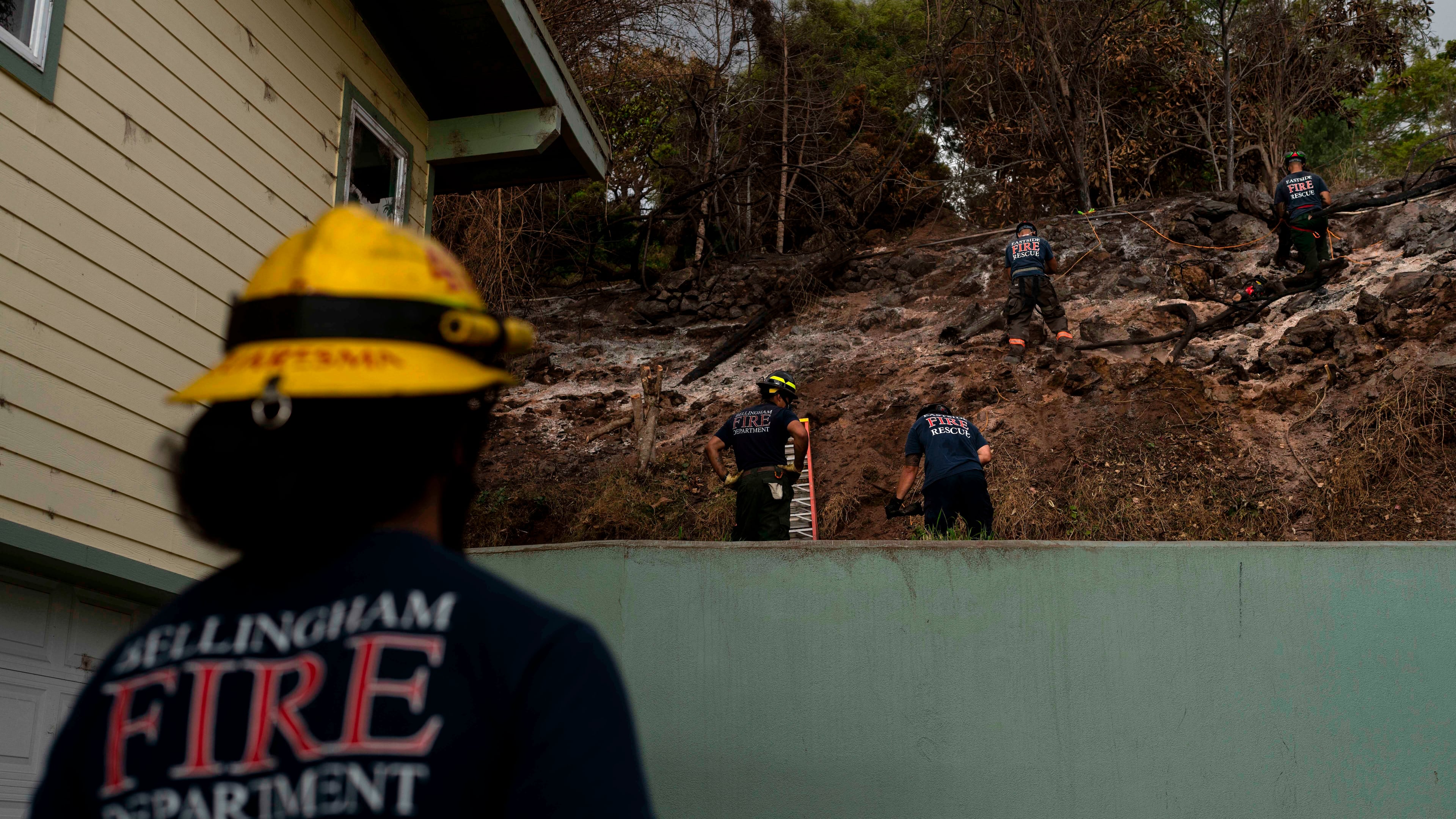 FILE - Firefighters clear debris in Kula, Hawaii, Aug. 15, 2023, following wildfires that devastated parts of the Hawaiian island of Maui. (AP Photo/Jae C. Hong, File)