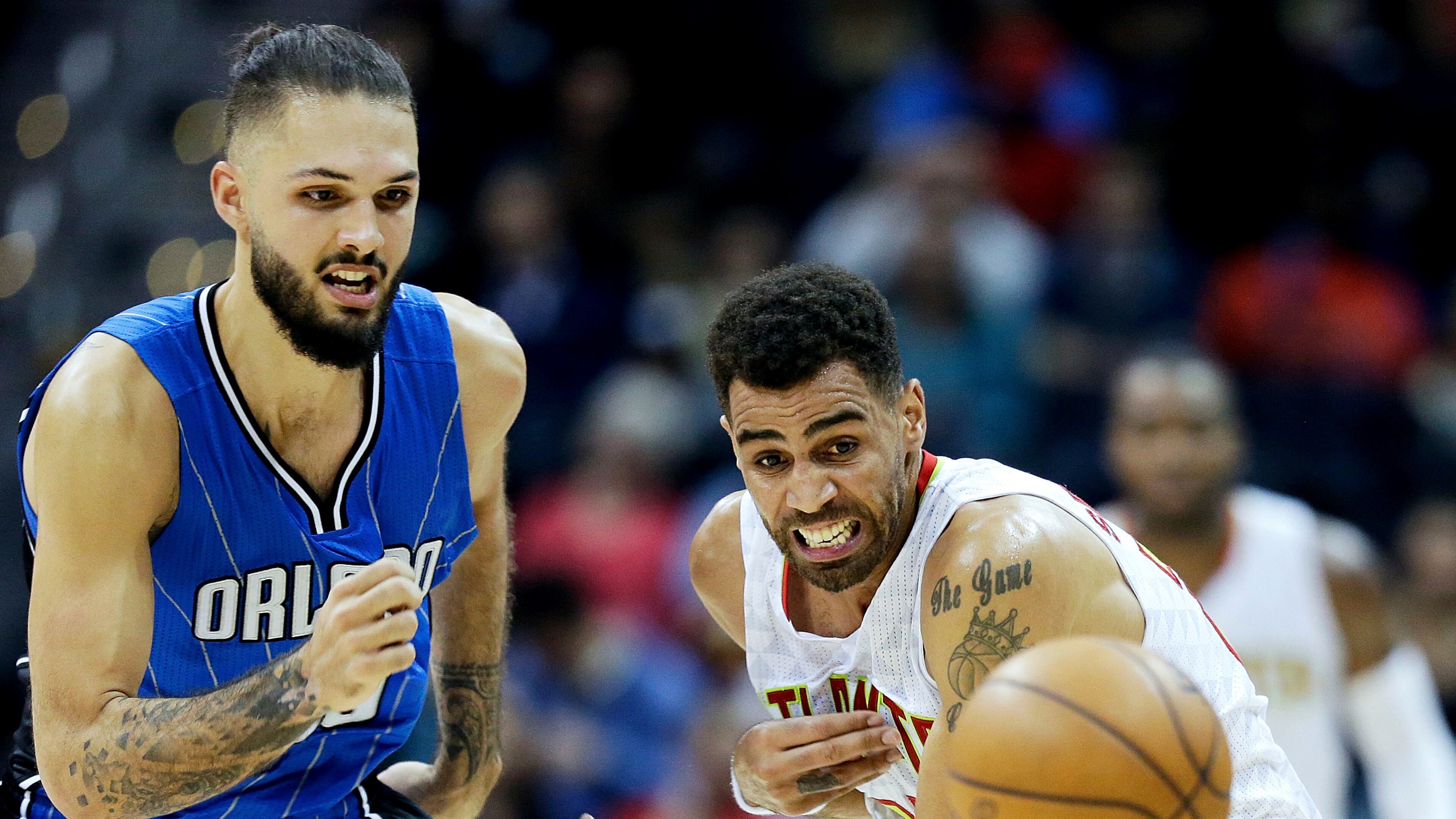 Atlanta Hawks’ Thabo Sefolosha, right, of Switzerland, and Orlando Magic’s Evan Fournier, of France, chase the ball in the second quarter of an NBA basketball game in Atlanta, Tuesday, Dec. 13, 2016. (AP Photo/David Goldman)
