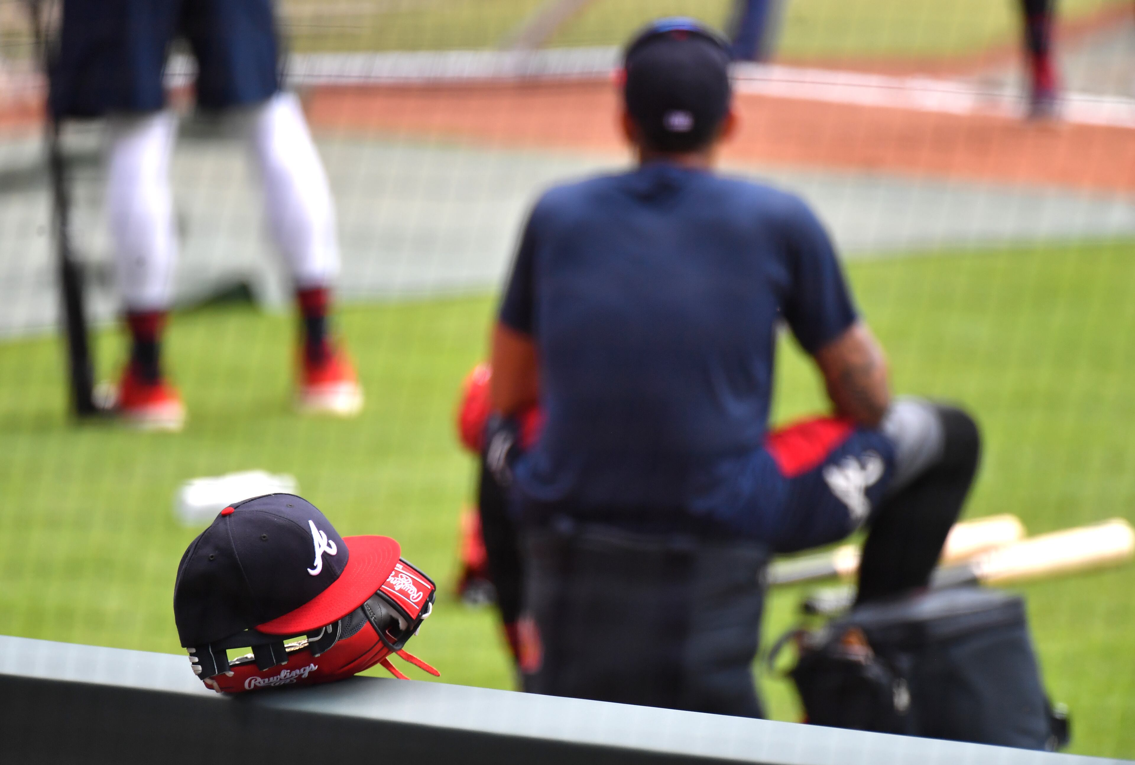 The Braves hat and glove of center fielder Ronald Acuna Jr. . (Hyosub Shin / Hyosub.Shin@ajc.com)