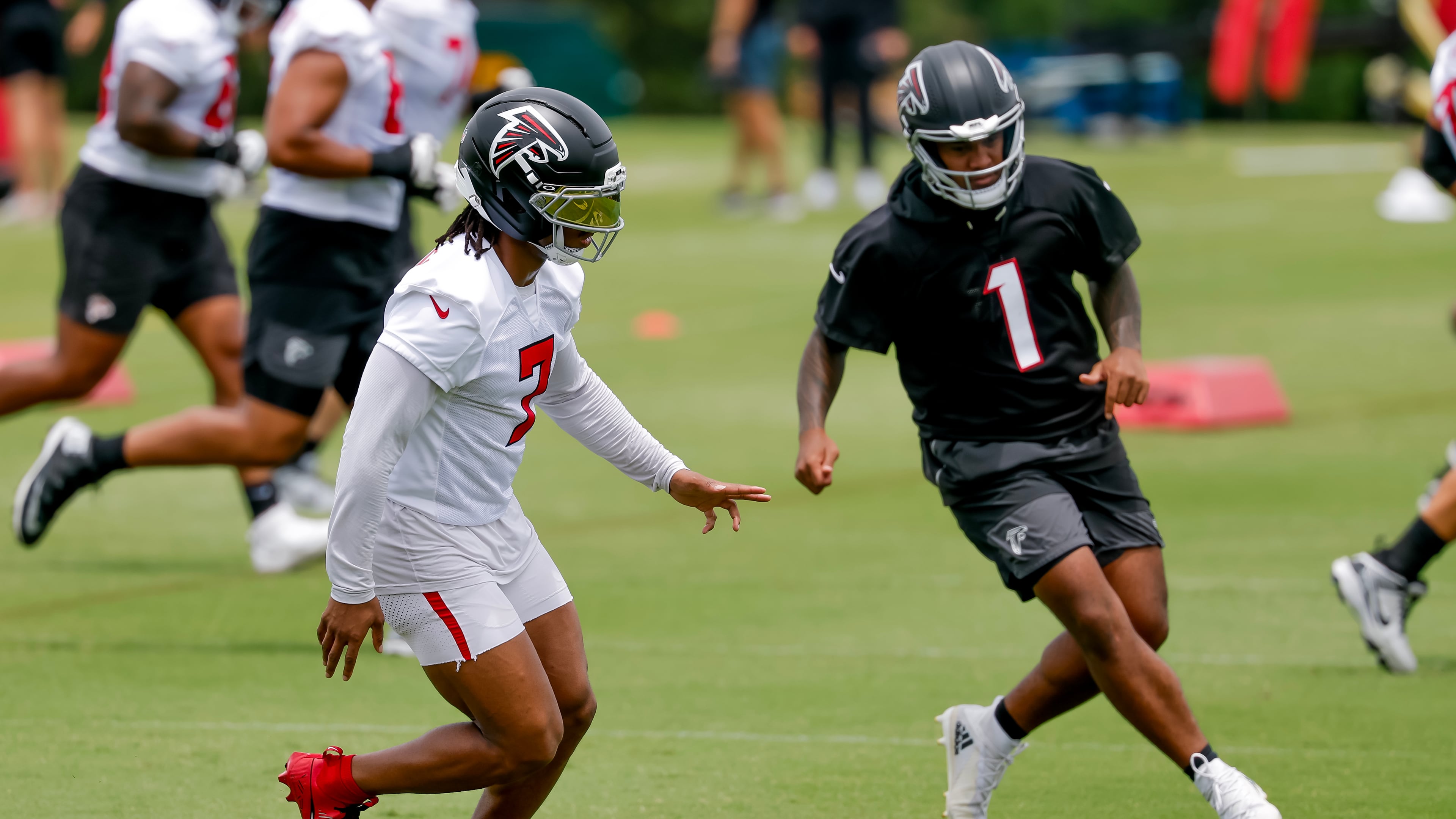 Falcons running back Bijan Robinson (left) and quarterback Tua Tagovailoa participate in practice on Monday, June 8, 2026, in Flowery Branch. Tagovailoa’s accuracy has long been his calling card, and it was on full display this summer. (Erik S. Lesser for the AJC)
