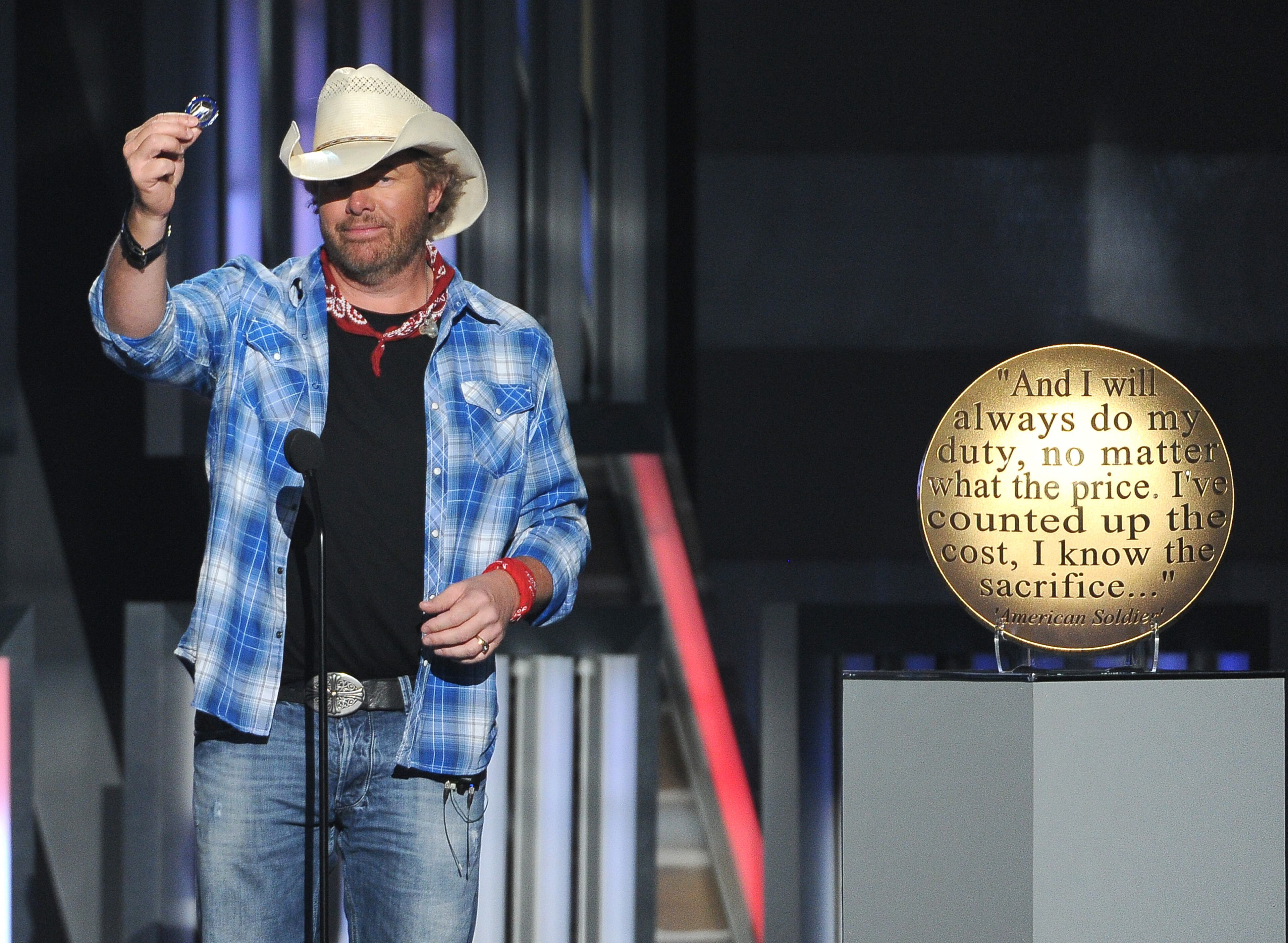 Toby Keith performs at ACM Presents an All-Star Salute to the Troops on Monday, April 7, 2014, in Las Vegas. (Photo by Chris Pizzello/Invision/AP)
