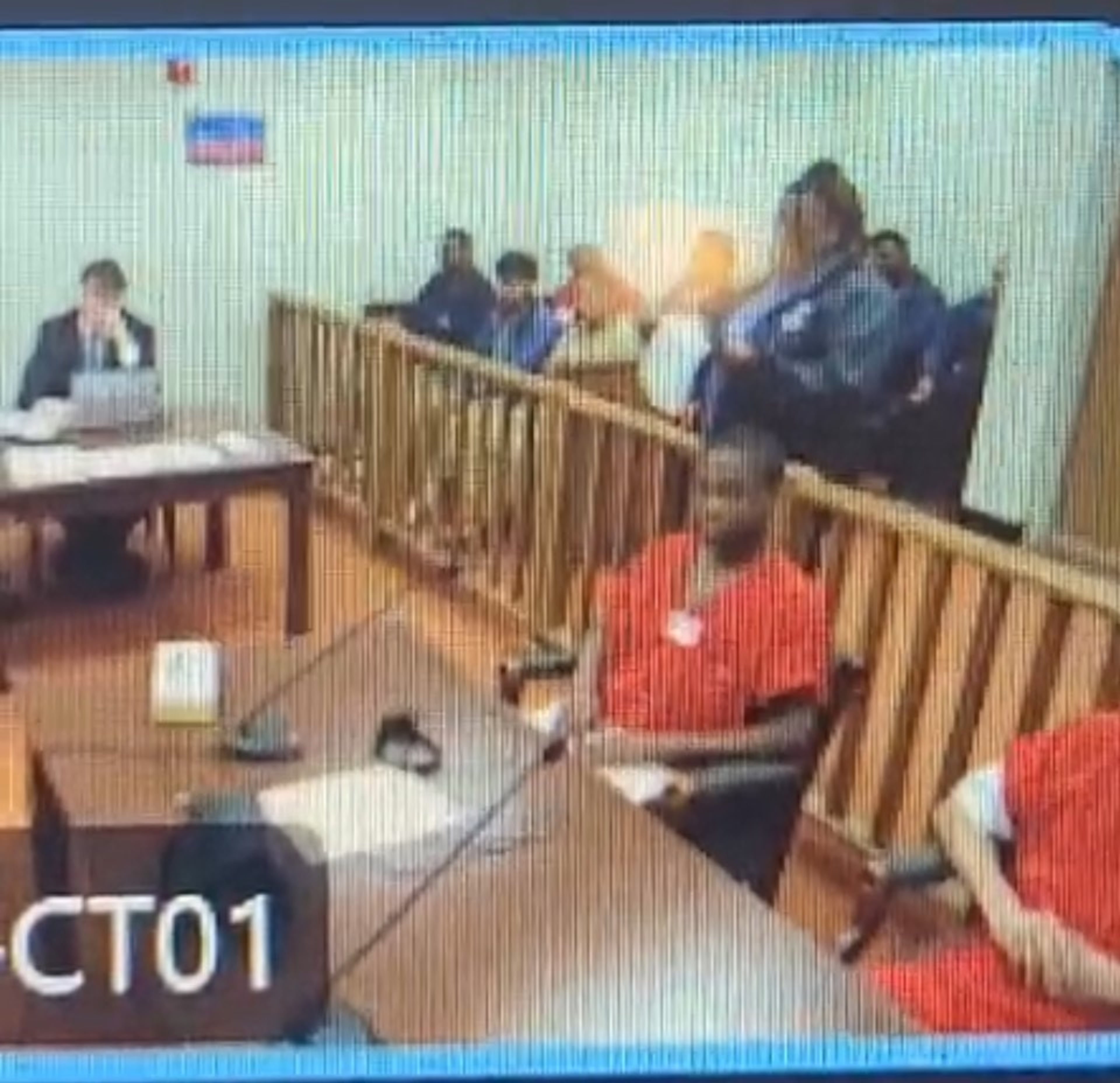 Jerome Lawrence, center, at a hearing in April at ICE's Stewart Detention Center, when he was ordered to be deported. (From ICE video)