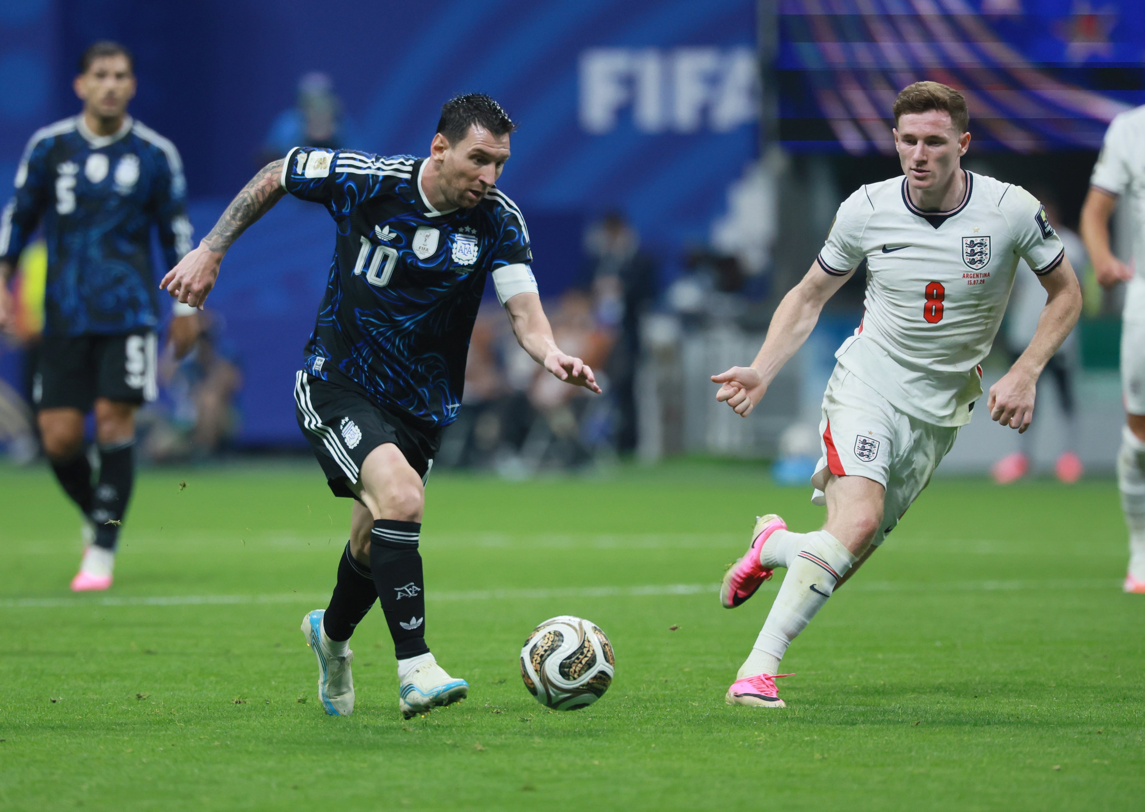 Argentina's Lionel Messi, left, moves the ball past England's Elliot Anderson during first half of Argentina vs. England FIFA World Cup Semifinal match at Atlanta Stadium (Mercedes-Benz Stadium) on Wednesday, July 15, 2026. (Jason Getz/AJC)