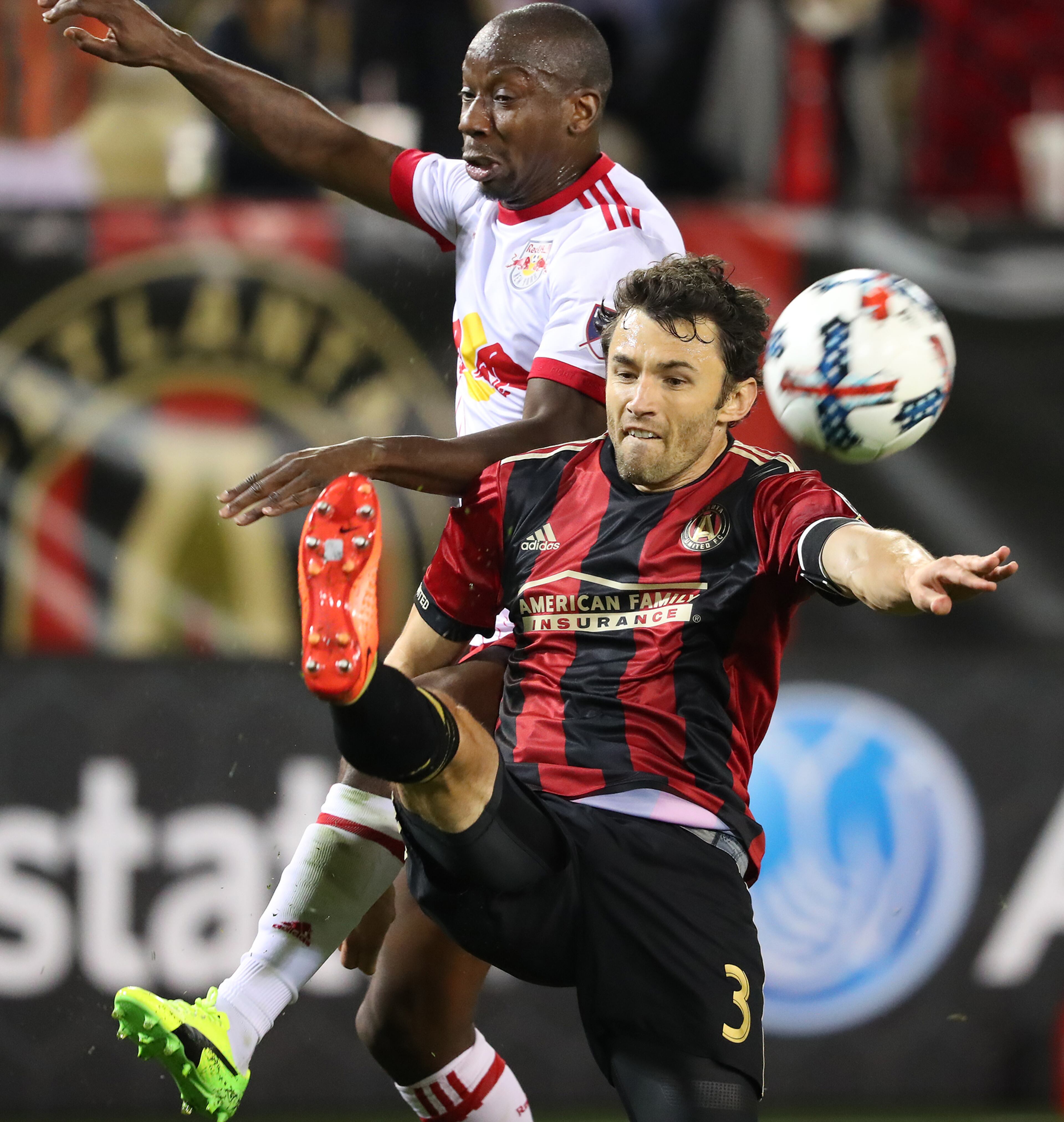Atlanta United's Michael Parkhurst reverses the field against N.Y. Red Bulls Bradley Wright-Phillips with a backwards kick during the second half.
