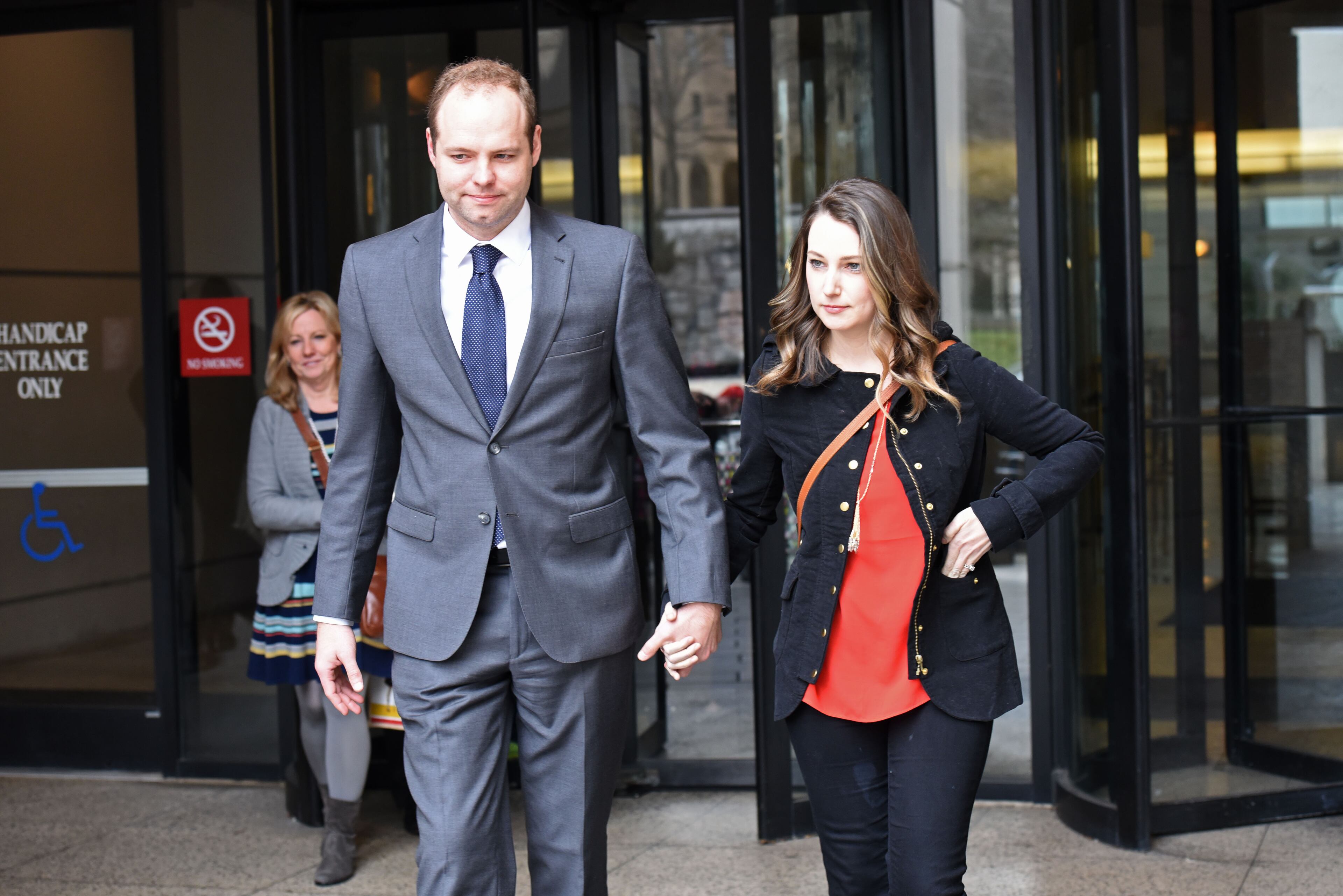 Michael and Whitney Lash leaves Fulton County Superior Court on Thursday, Jan. 28, 2016. HYOSUB SHIN / HSHIN@AJC.COM