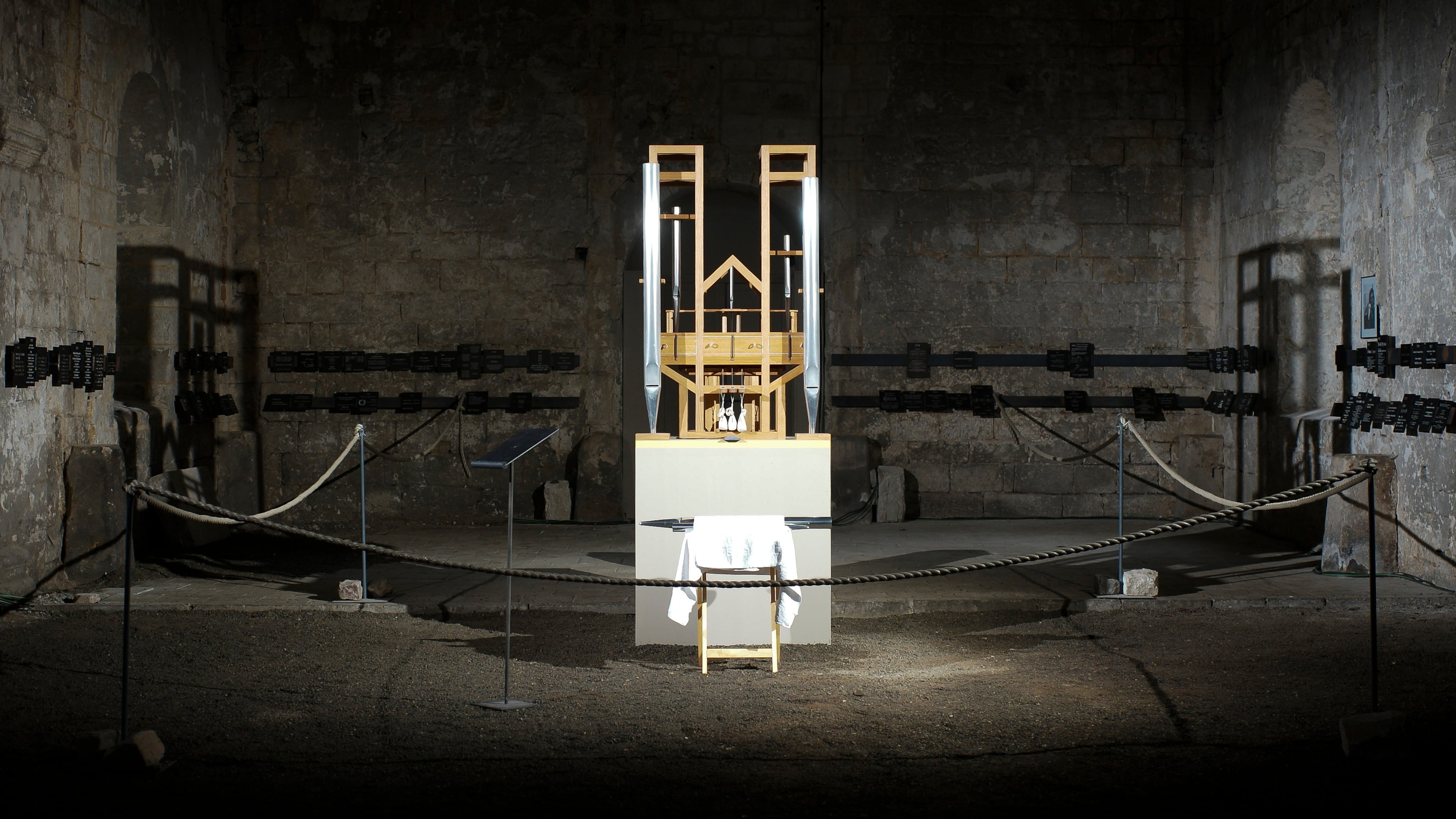 FILE - The organ of the John Cage organ project is illuminated prior to a 'sound change' at the Buchardi Church in Halberstadt, Germany, Sept. 5, 2020. (AP Photo/Markus Schreiber, File)