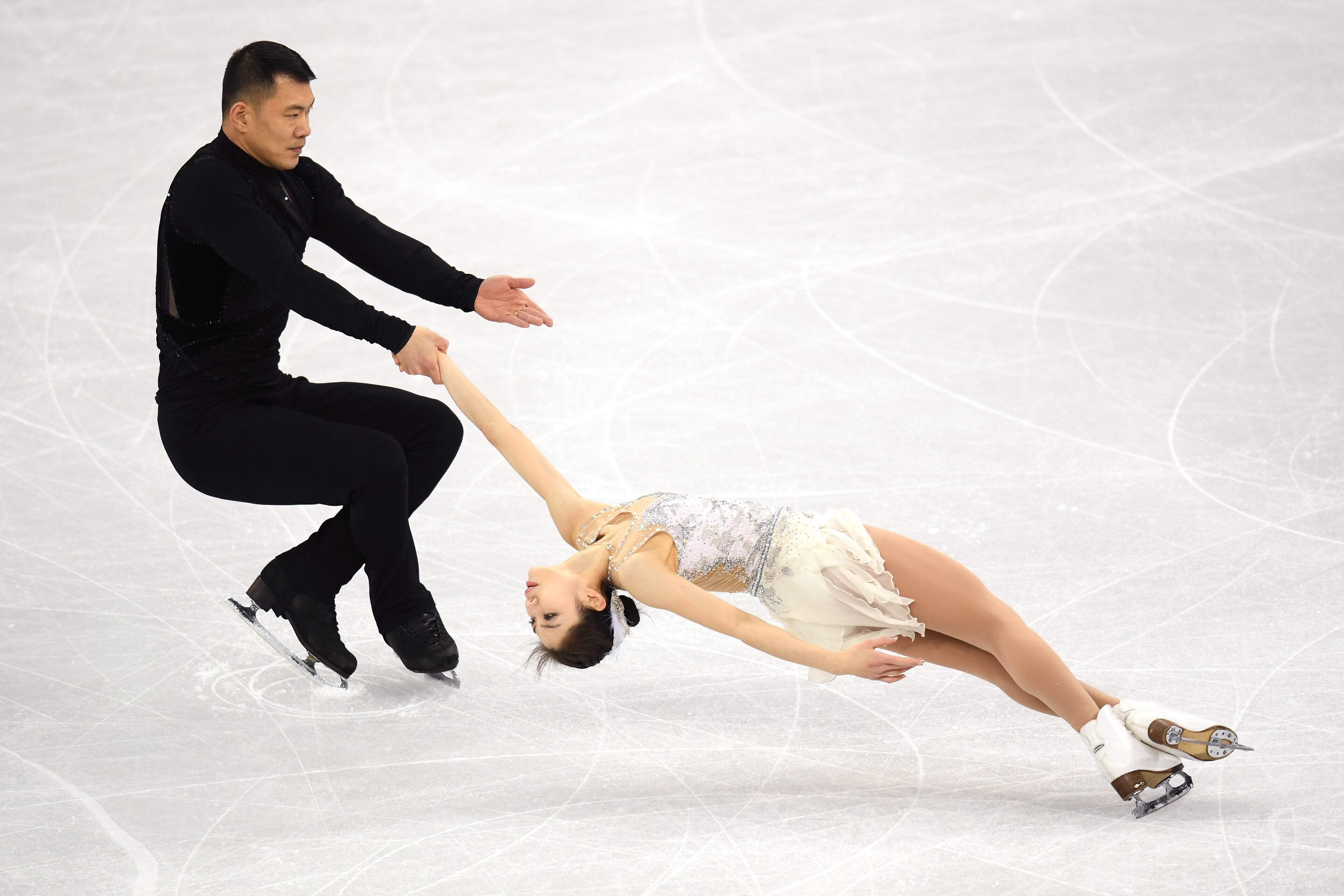 GANGNEUNG, SOUTH KOREA - FEBRUARY 09: Xiaoyu Yu and Hao Zhang of China compete in the Figure Skating Team Event - Pair Skating Short Program during the PyeongChang 2018 Winter Olympic Games at Gangneung Ice Arena on February 9, 2018 in Gangneung, South Korea. (Photo by Harry How/Getty Images)