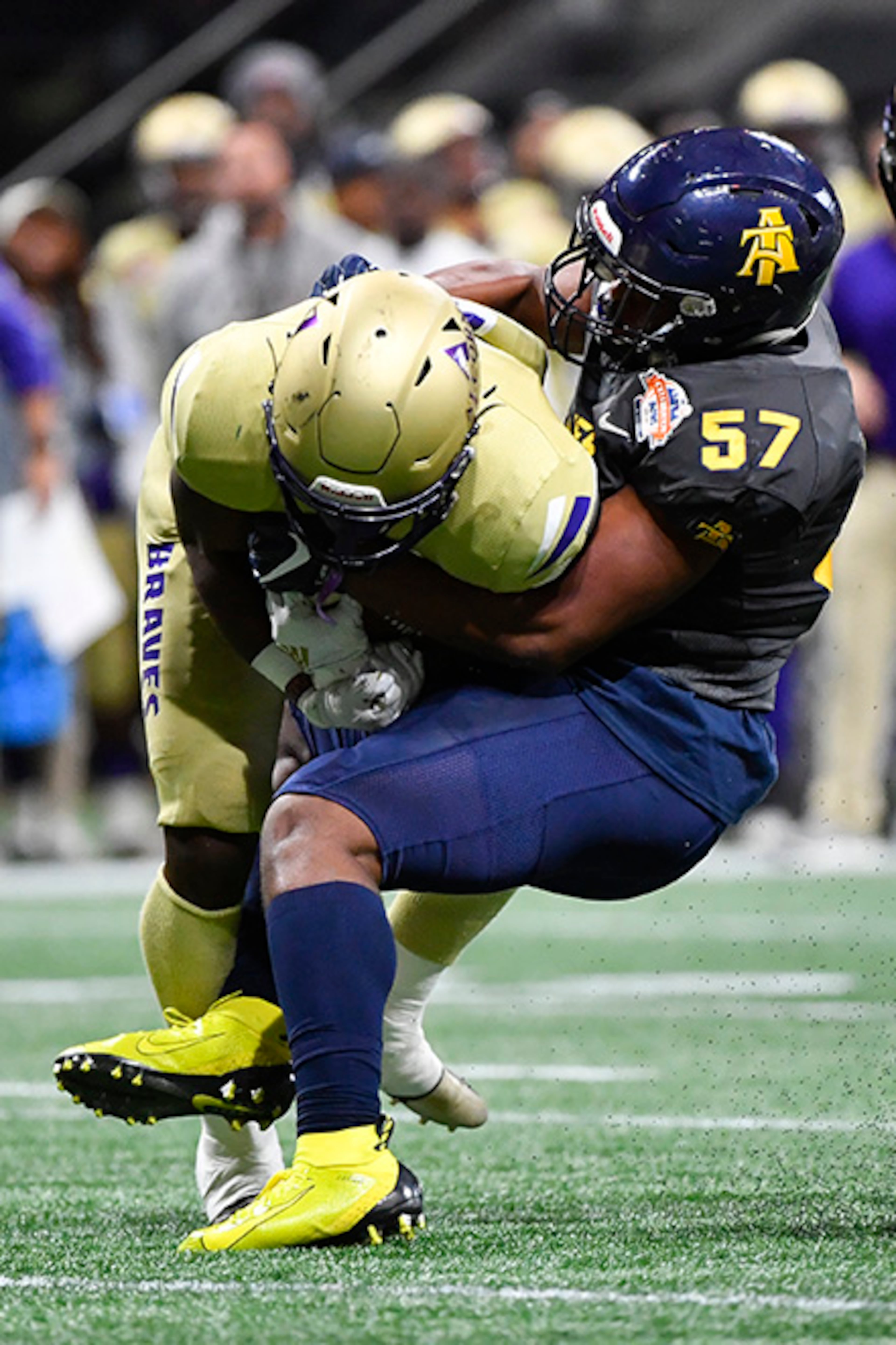 North Carolina A&T linebacker Jacob Roberts (57) brings down Alcorn State tight end Jerimiah Green during the first half of the Celebration Bowl Saturday, Dec. 21, 2019, at Mercedes-Benz Stadium in Atlanta.