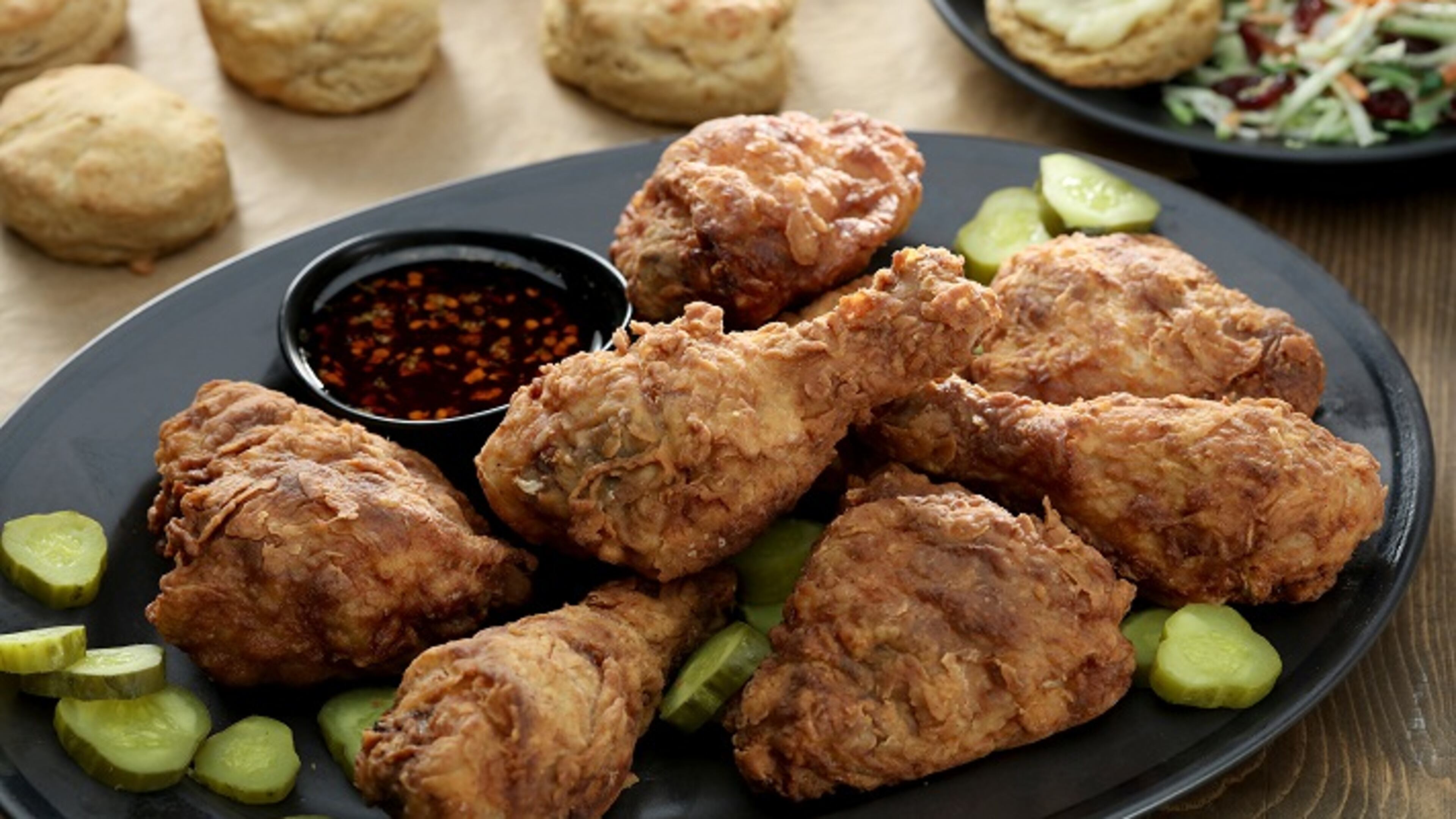 A spicy dipping sauce sweetened with agave syrup and flavored with hot sauce and red pepper flakes ups the heat factor. Smoked cheddar and sweet potato biscuits are great companions. (Michael Tercha/Chicago Tribune/TNS)