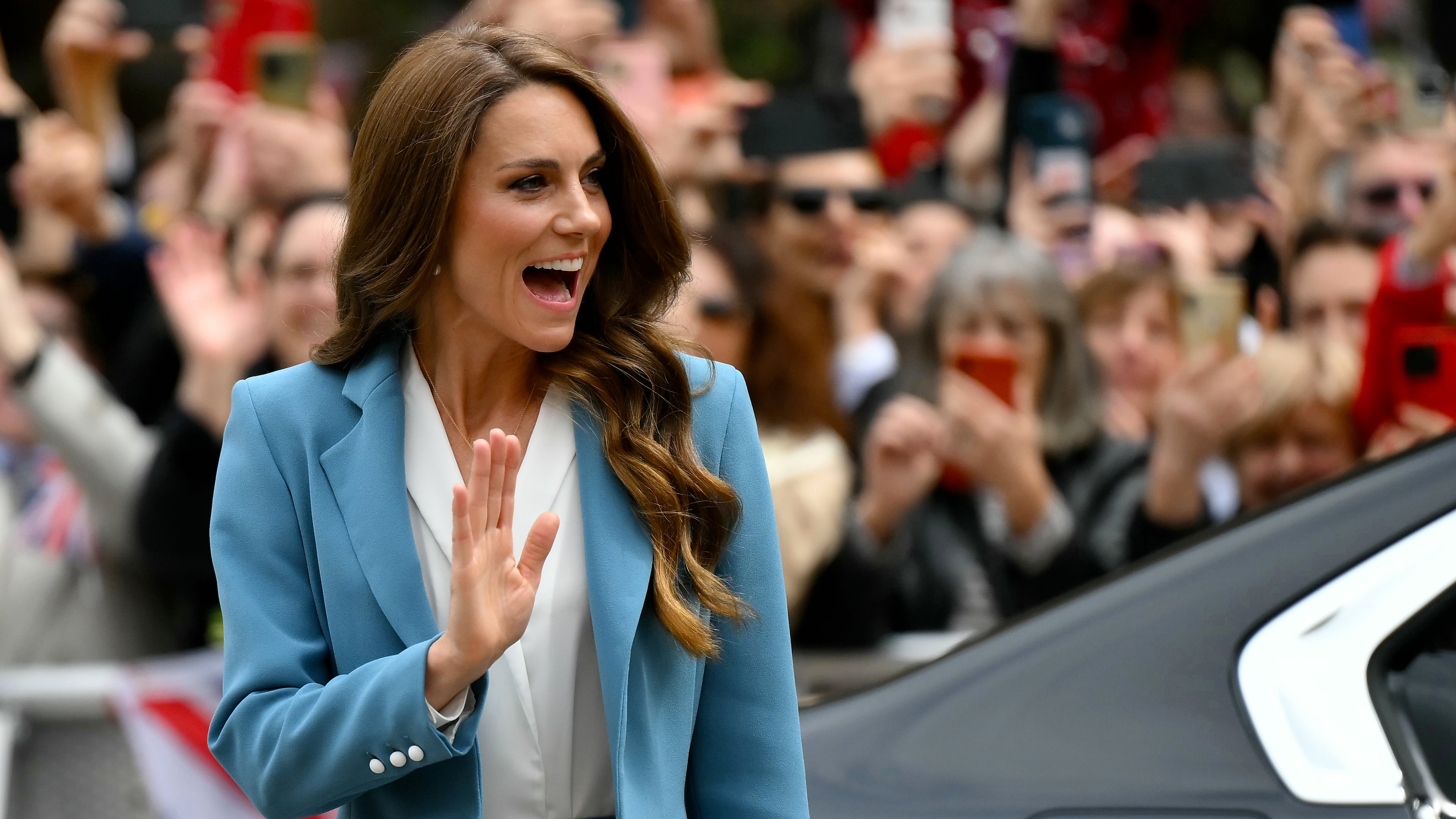 Britain's Kate, Princess of Wales, waves as she arrives at the town hall, part of a two-day trip, in Reggio Emilia, Italy, Wednesday, May 13, 2026. (Marco Bertorello/Pool Photo via AP)