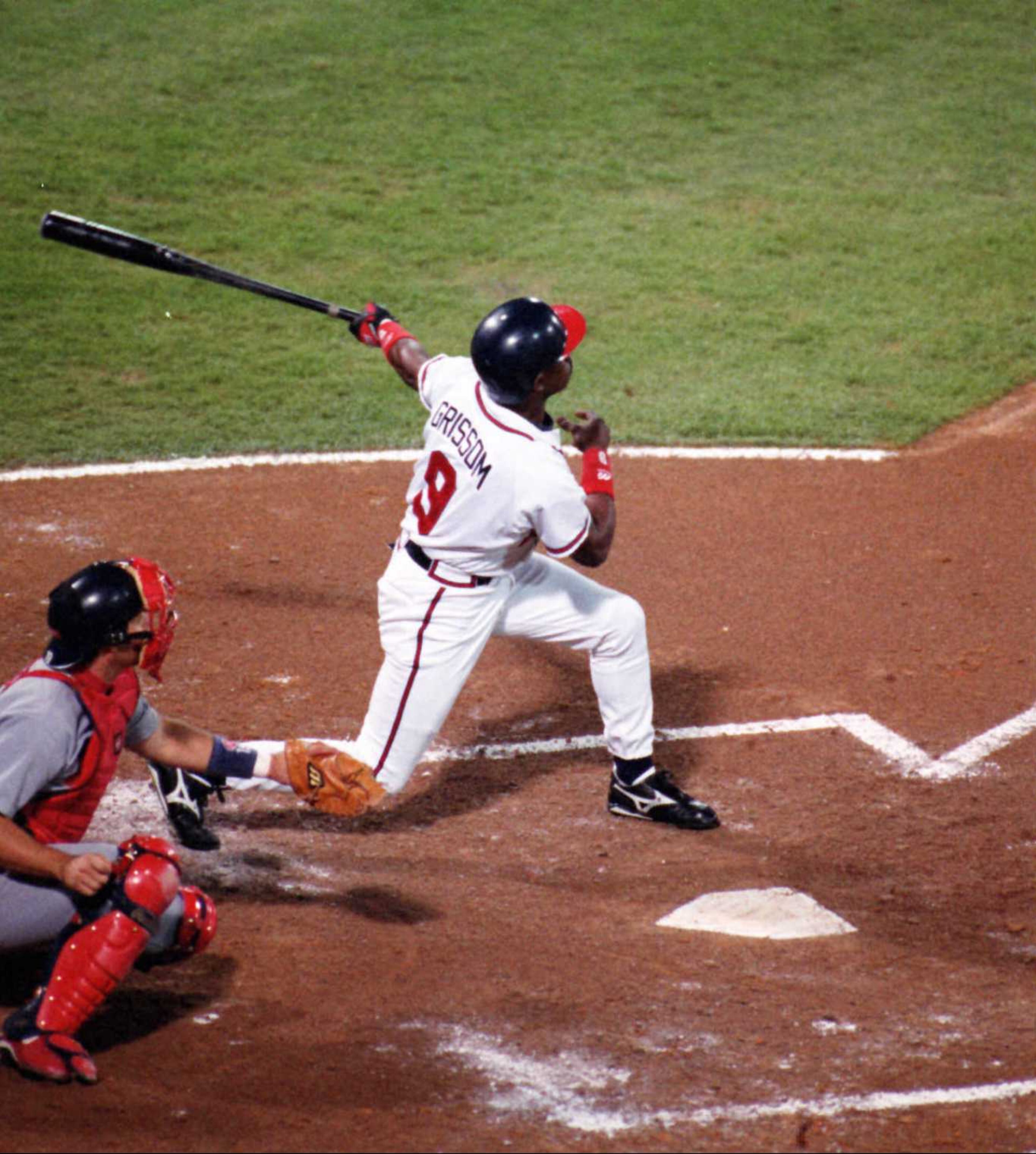 The Braves' Marquis Grissom homers against St. Louis in 1996.