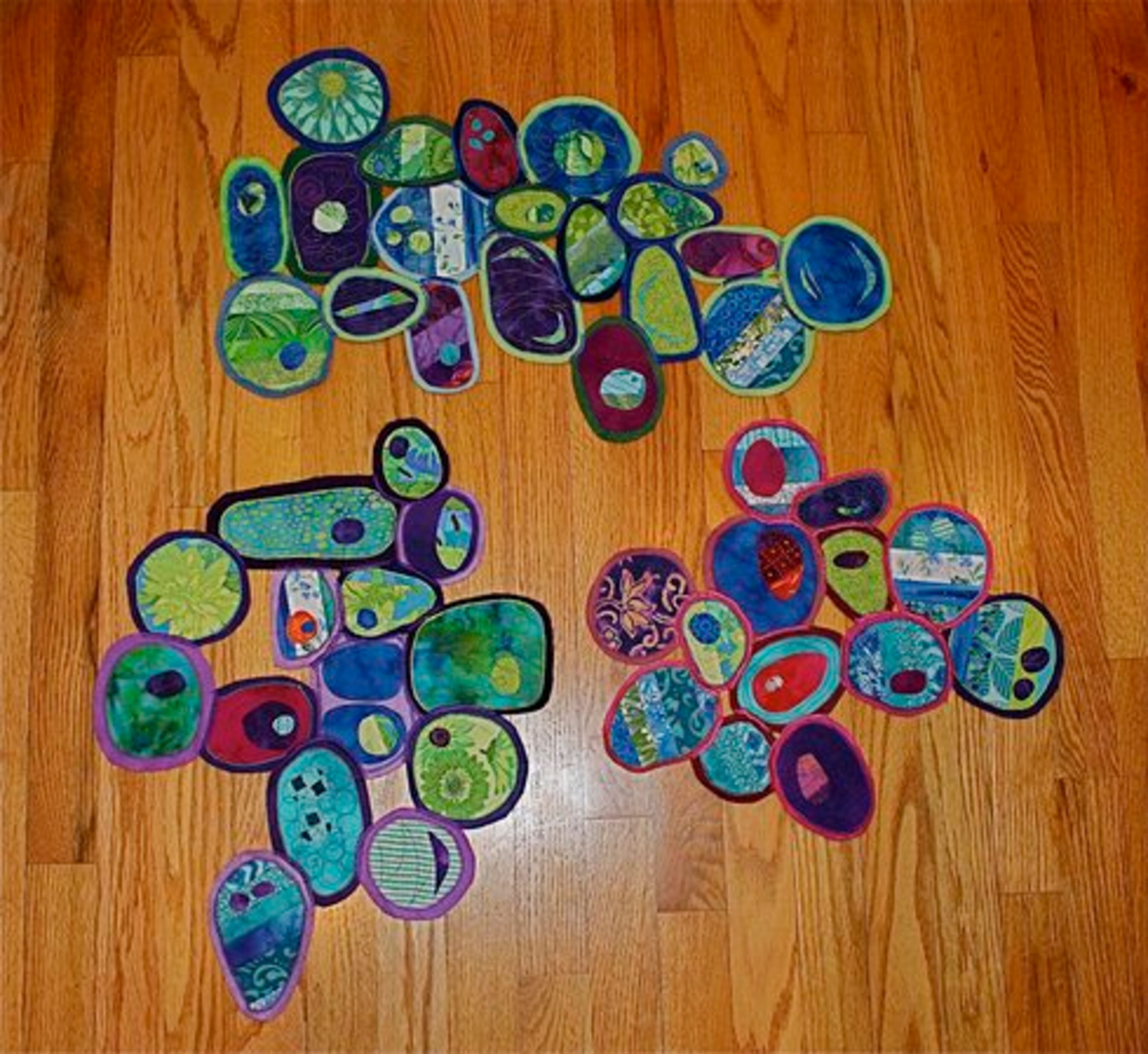 Geri deGruy, of Castle Rock, Colo., shows her "Circles" quilt. DeGruy connected individually quilted circles in free-flowing arrangements to make her "Circles" art quilts, which range in size from 11 inches by 13 inches to 10 inches by 20 inches.