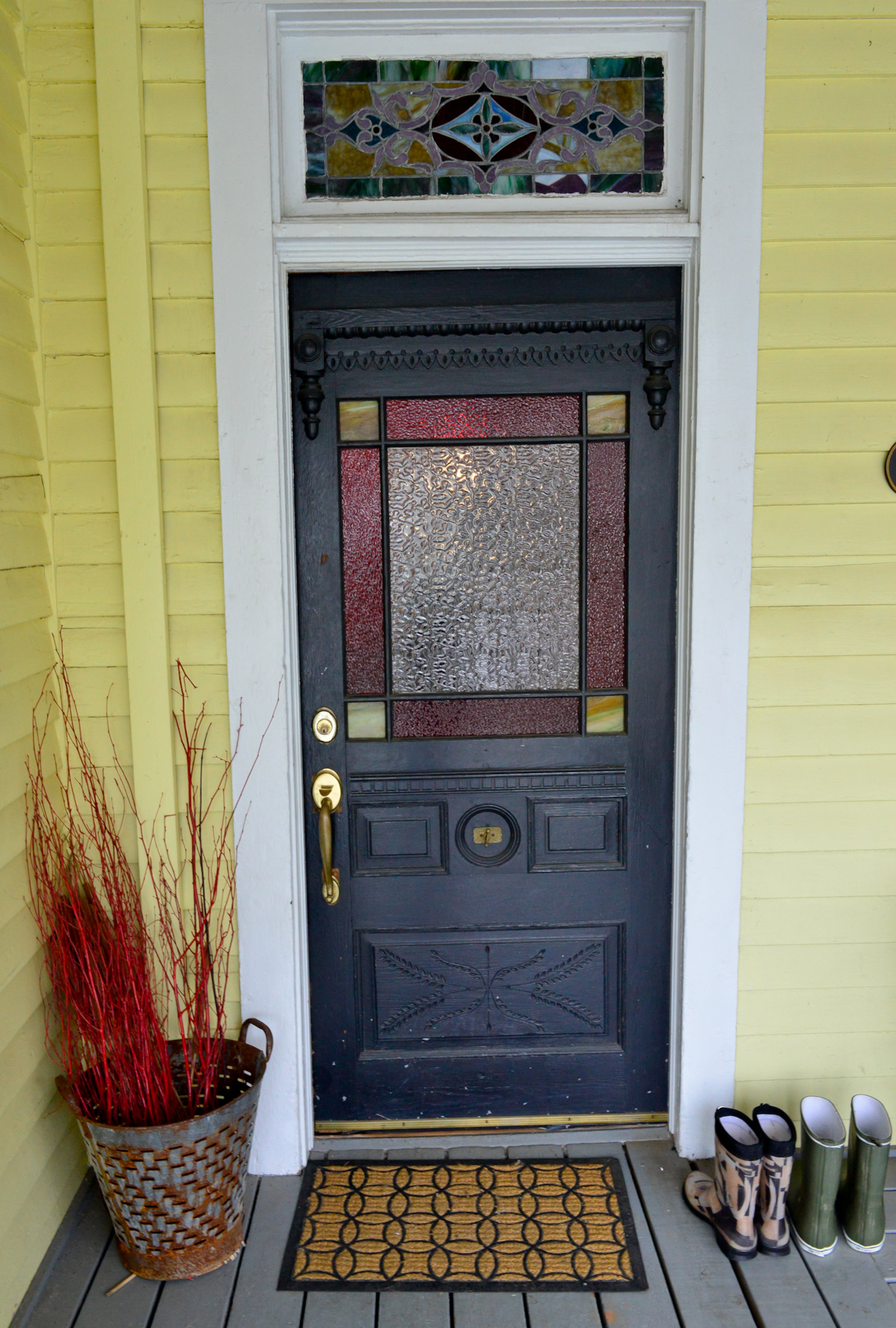 Original stained glass and a brass door bell built into the front door add historic elements to Nick and Kendall Stowell's Inman Park home, which was built in 1896. The front porch is like a "second living room," Kendall said.