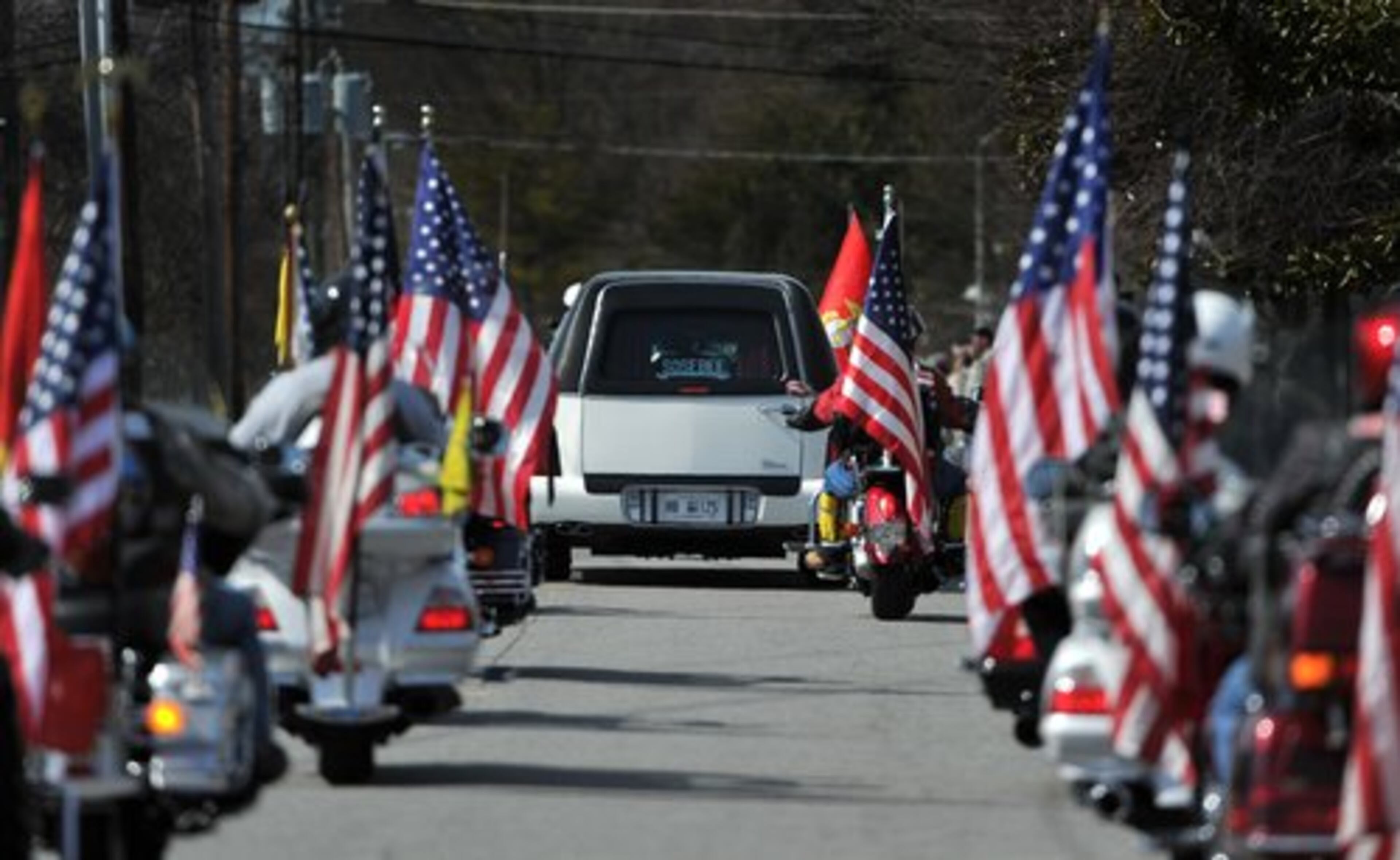 The body of Jason H. Estopinal leaves Dobbins Air Reserve Base.