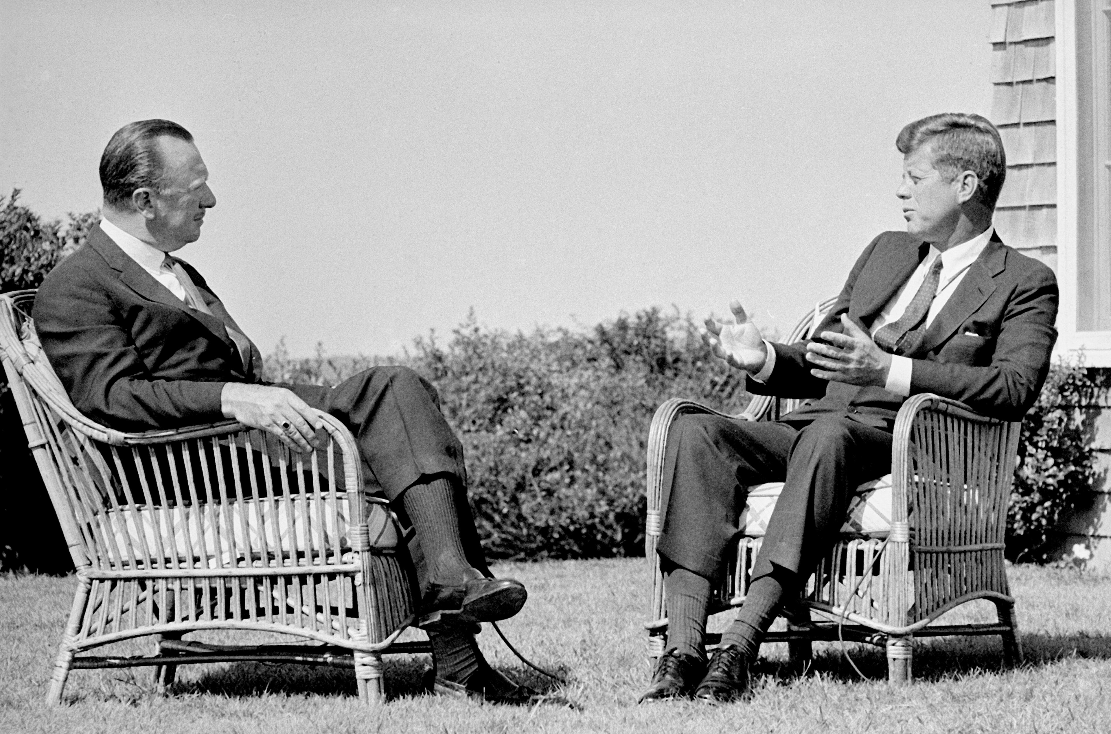 President John Kennedy talks with CBS ancor Walter Cronkite during a taped television interview at the President's summer home at Hyannis Port, Ma. Two-and-a half months later, Cronkite would announce the President's death in one of television's most memorable moments. (AP Photo/CBS, File)