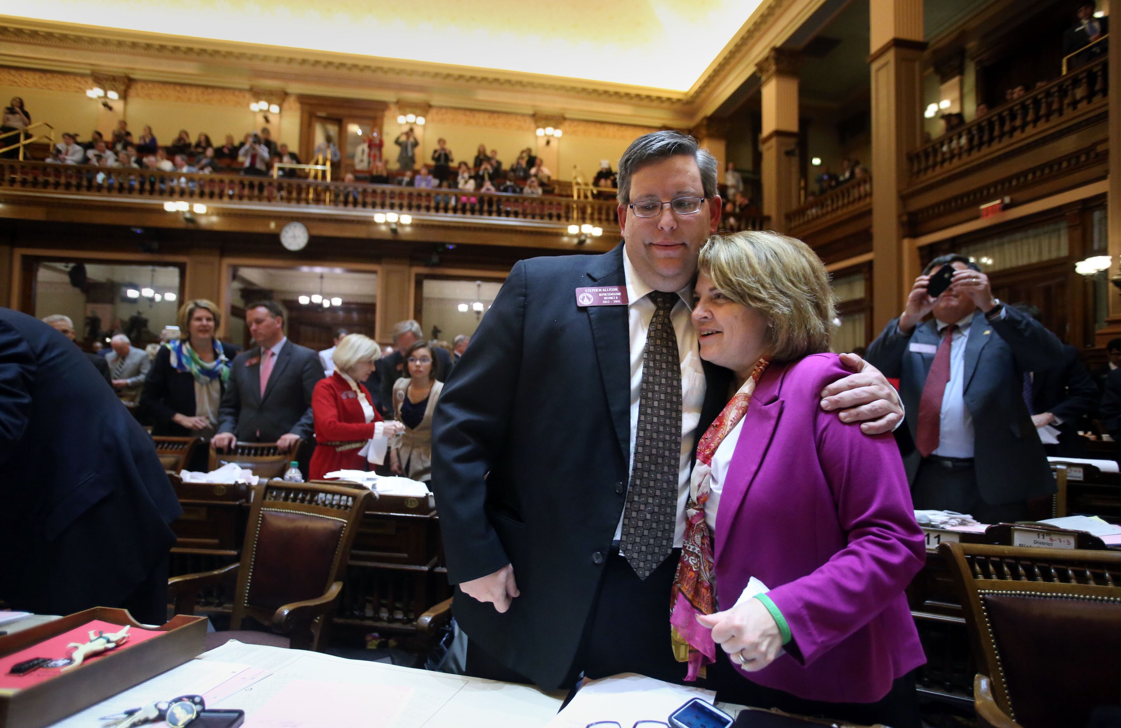 Rep. Stephen Allison, R-Blairsville, left, and Rep. Donna Sheldon, R-Dacula, say their goodbyes minutes before, "Sine Die," at the end of Legislative Day 40 in the House Chambers at the Capitol Thursday night in Atlanta, Ga., March 28, 2013.