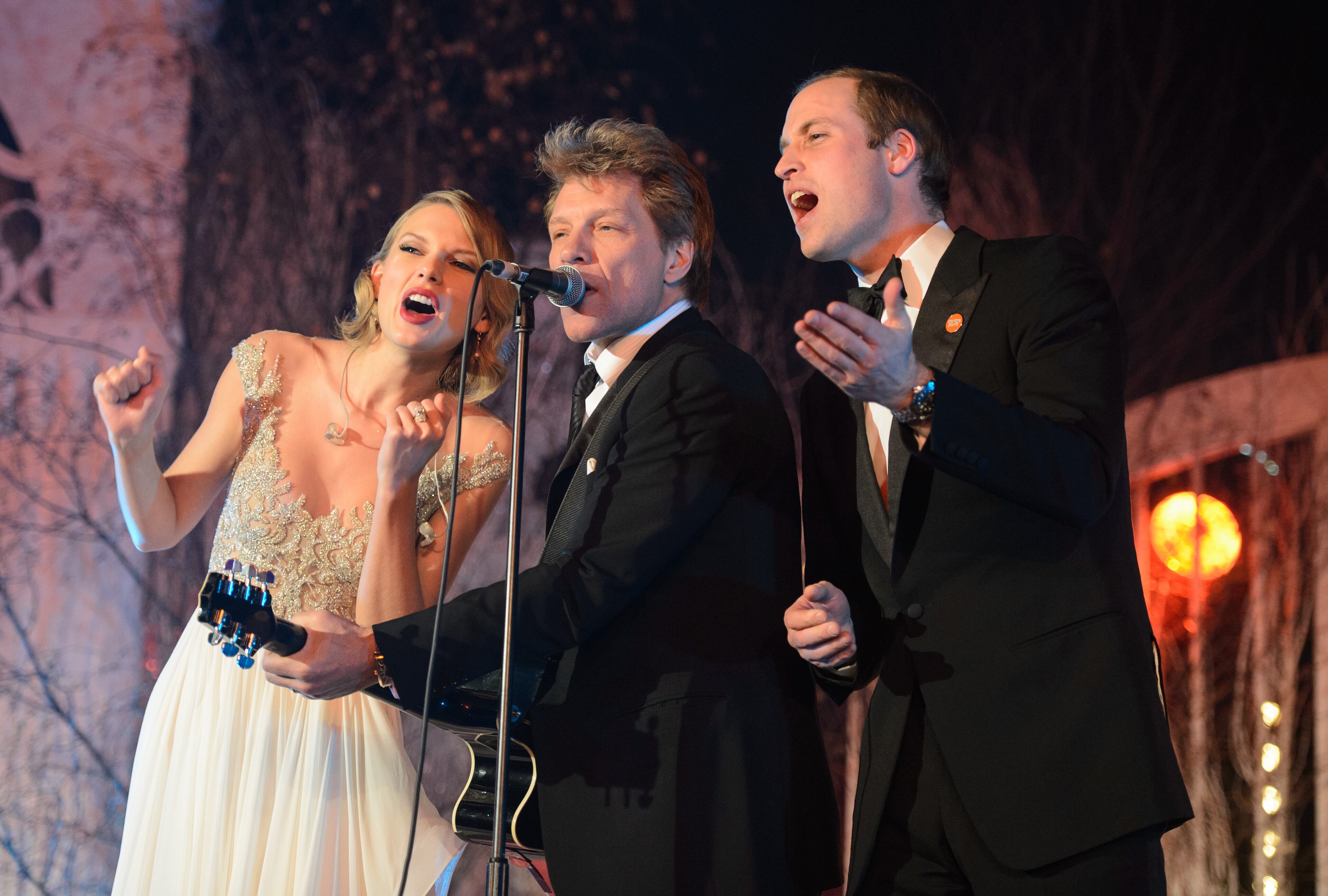 1. TAYLOR SWIFT: Taylor Swift (left), Jon Bon Jovi and Prince William, Duke of Cambridge, sing on stage at the Centrepoint Gala Dinner at Kensington Palace on Nov. 26, 2013, in London.