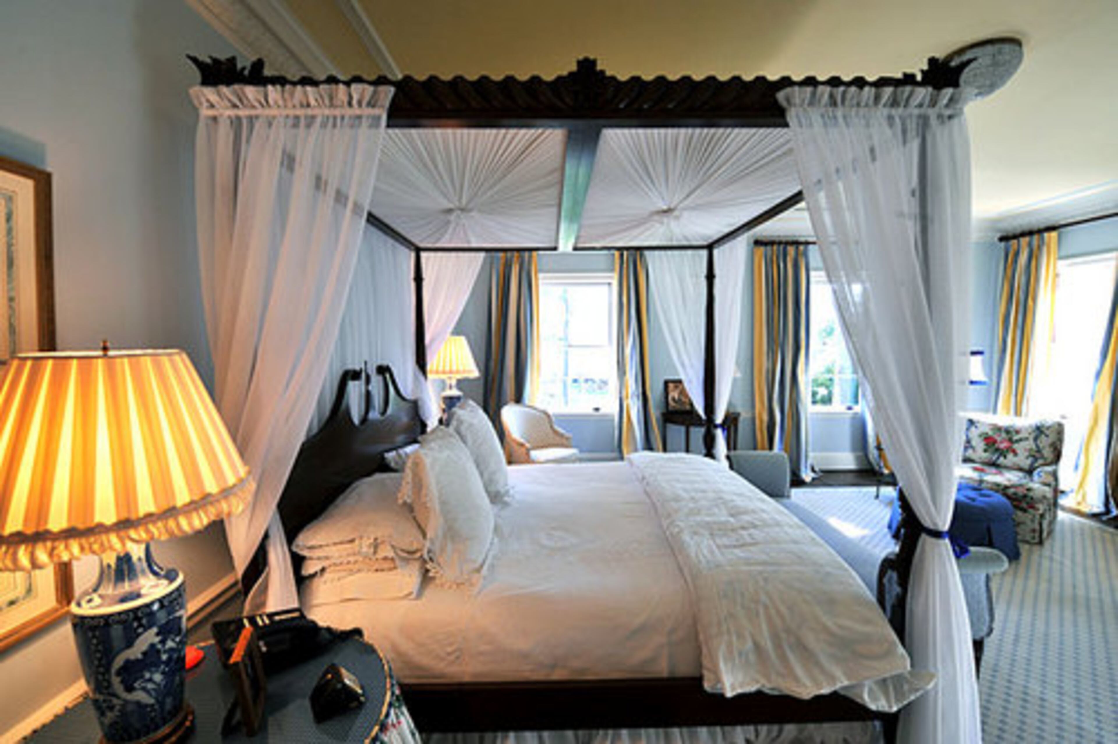 The master bedroom has a canopy bed.