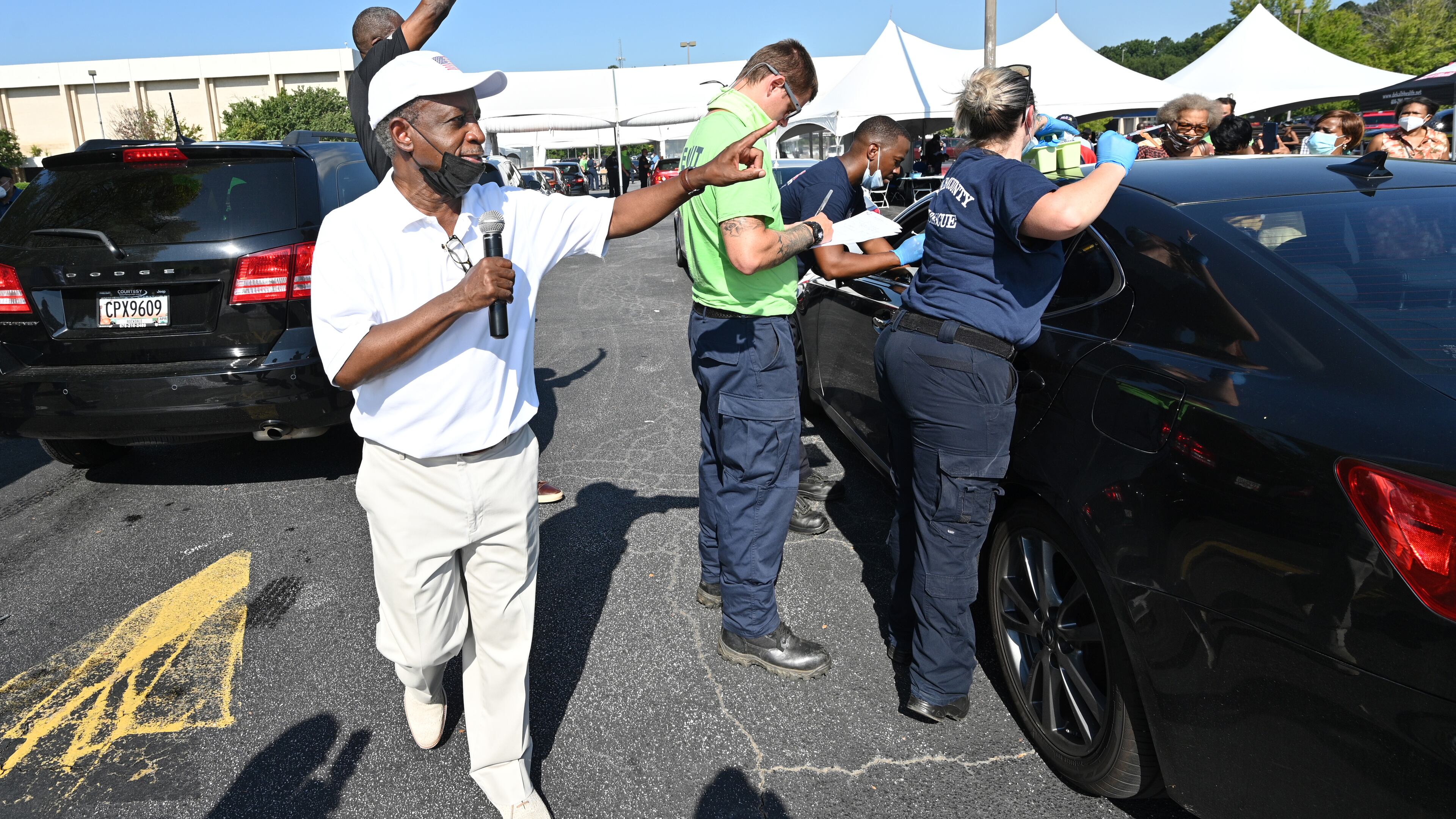 DeKalb County CEO Michael Thurmond encourages residents to get vaccinated during a vaccination event at The Gallery at South DeKalb in Decatur on Saturday, Aug. 13, 2021. The county gave out $100 prepaid debit cards to people who got shots. (Hyosub Shin / Hyosub.Shin@ajc.com)