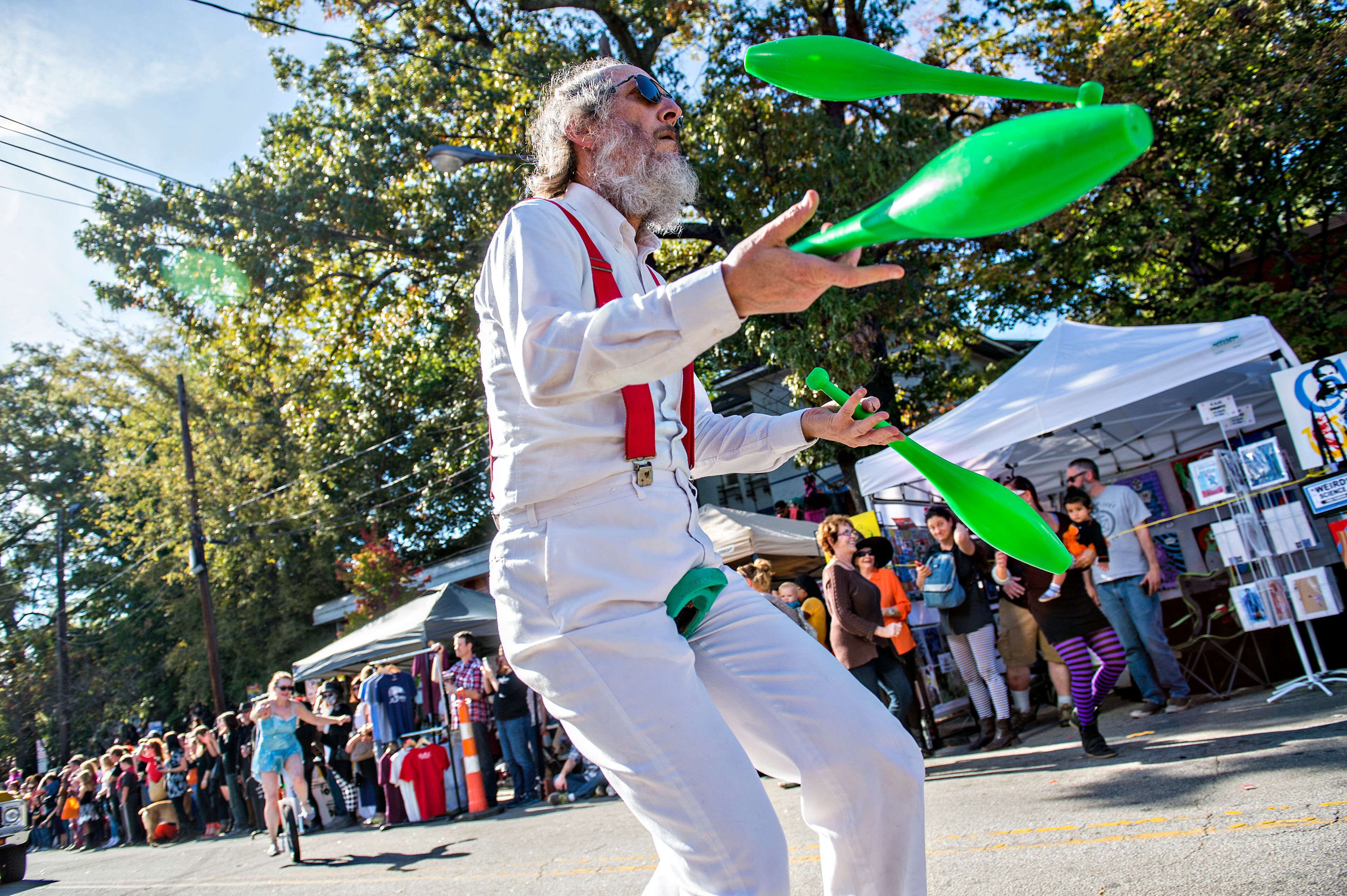 October 17, 2015 Atlanta - Charles Shapiro juggles as he rides his unicycle up the street during the Little Five Points Halloween Parade in Atlanta on Saturday, October 17, 2015. The annual parade brought out tens of thousands of people to watch the antics. JONATHAN PHILLIPS / SPECIAL