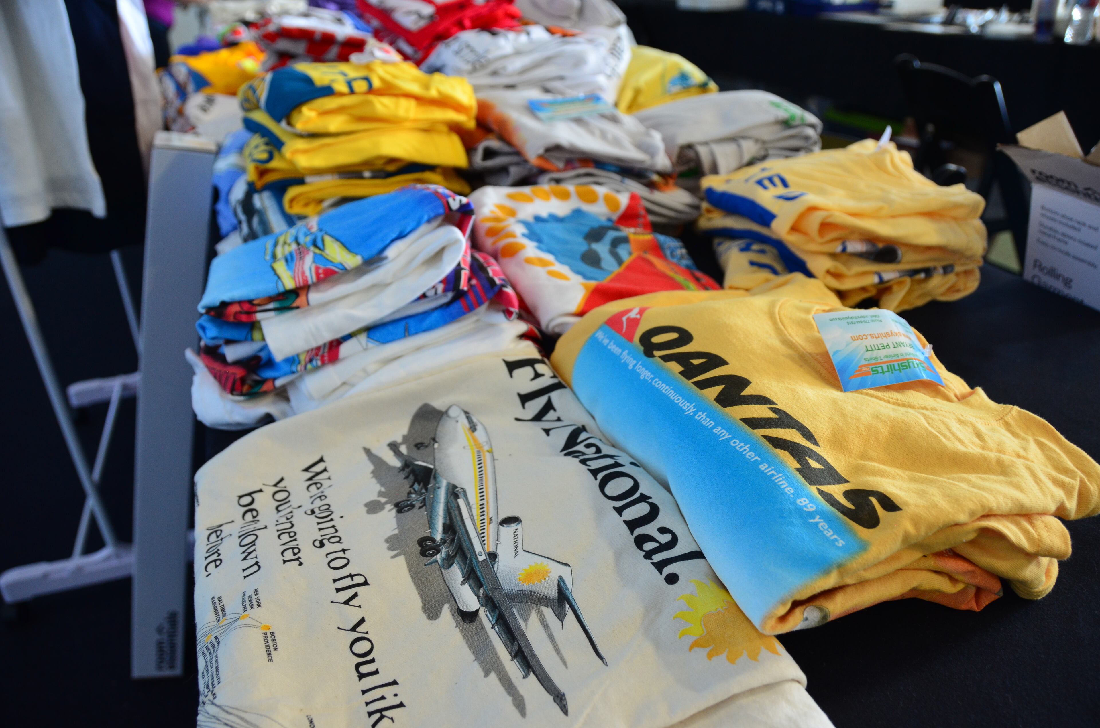 T-shirts are among the items on display at the Airliners International 2015 collectibles show at the Delta Flight Museum. (Kelly Yamanouchi / kyamanouchi@ajc.com)
