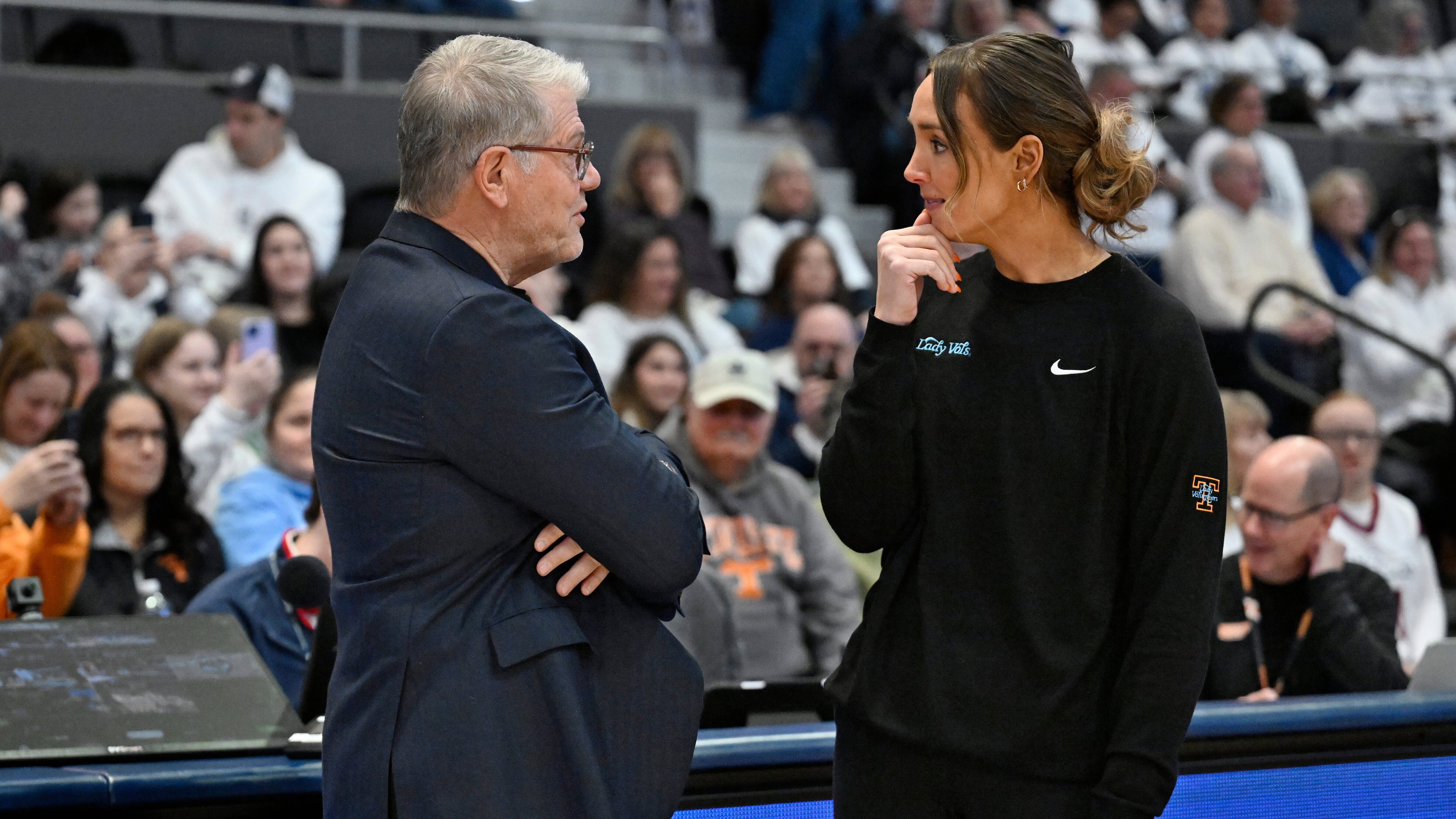 UConn head coach Geno Auriemma, left, talks with Tennessee head coach Kim Caldwell, right, before an NCAA college basketball game, Sunday, Feb. 1, 2026, in Hartford, Conn. (AP Photo/Jessica Hill)