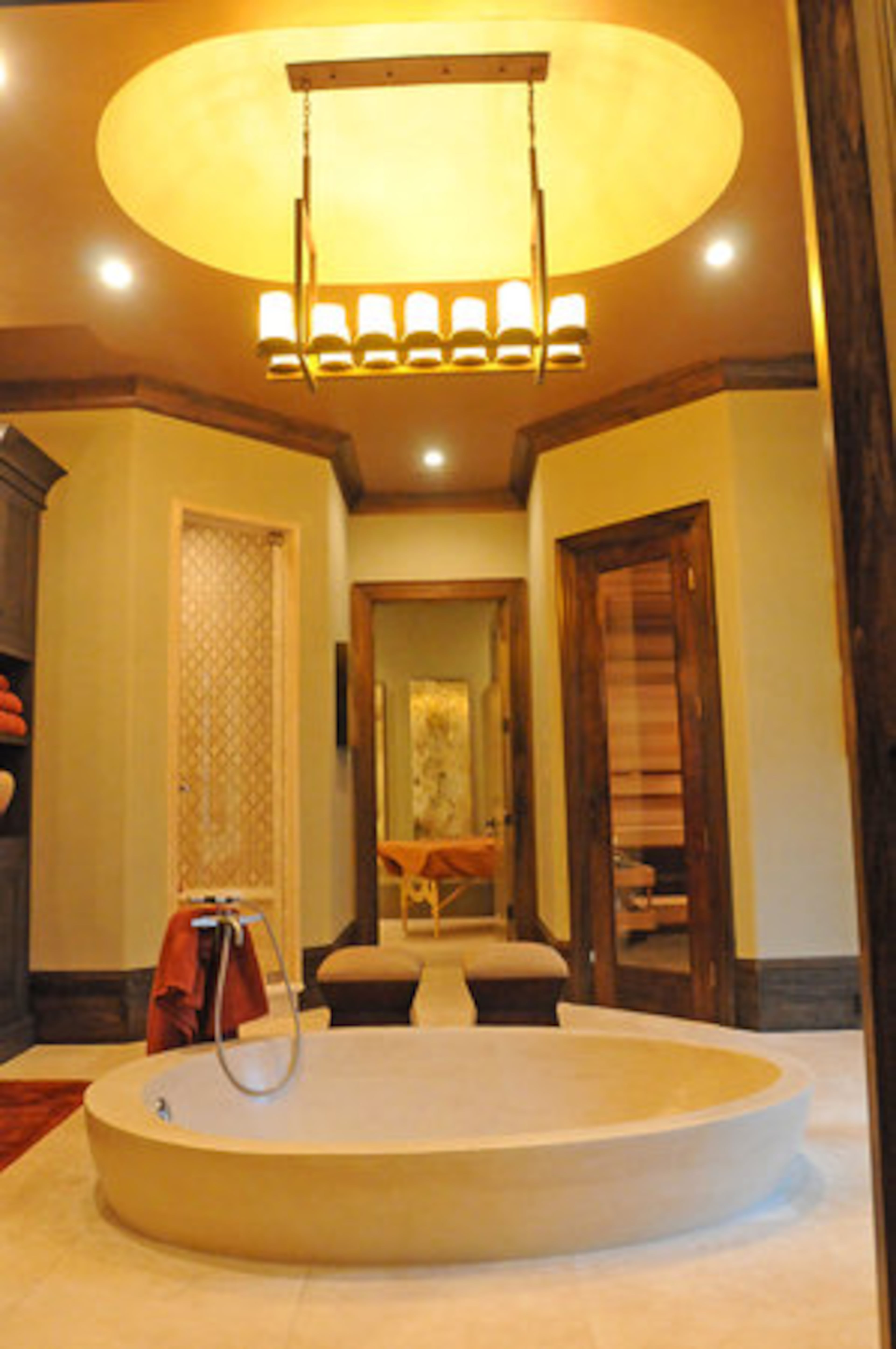 The Wellness Center was designed by The Interior Motive. The design scheme in this room takes a holistic approach, utilizing a palette of bronze, sand and auburn. Amenities include a custom-designed steam shower, dry sauna and meditation room.