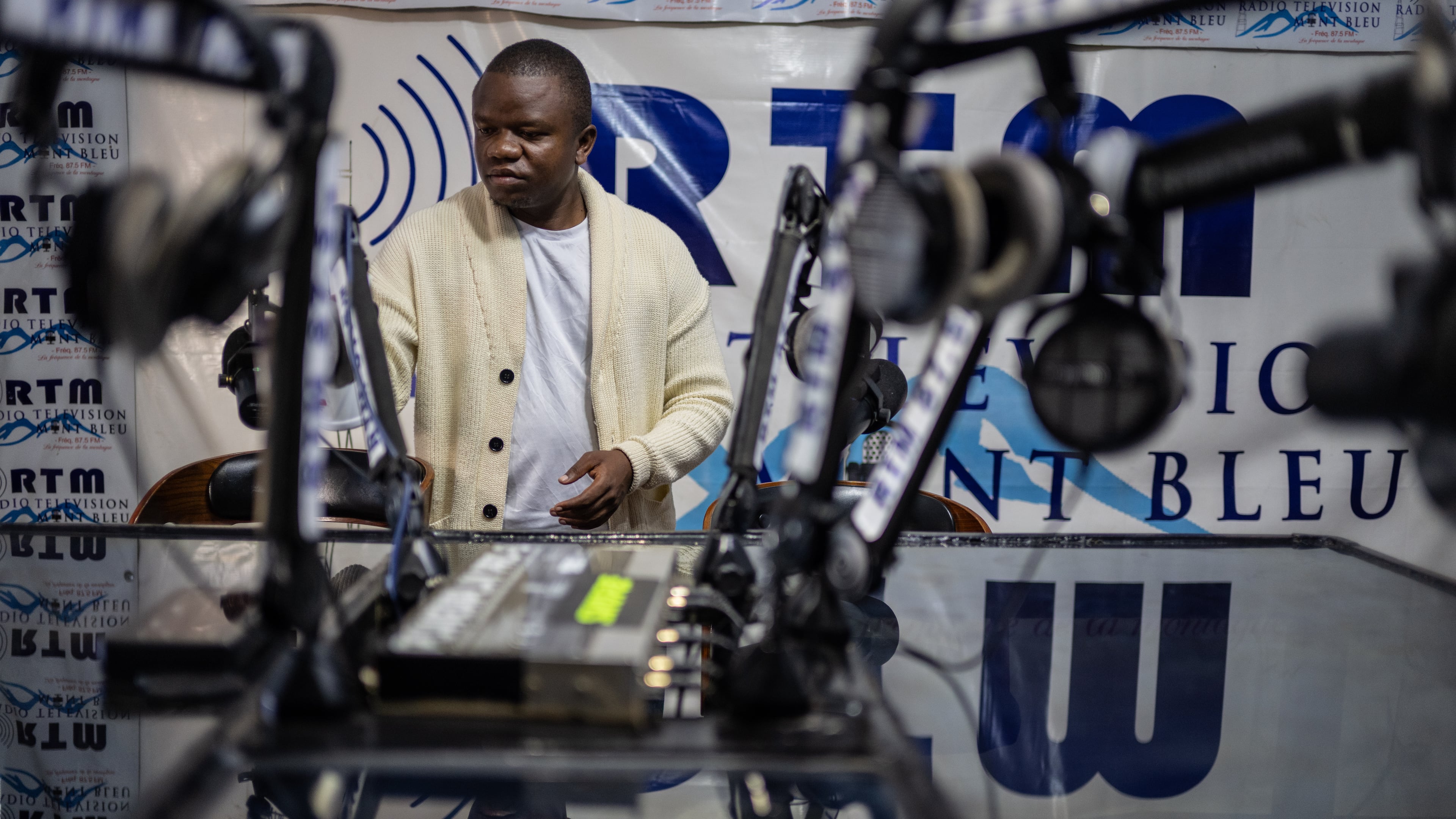 Verité Johnson works at a community radio station, providing daily awareness and updates on Ebola in Bunia, Congo, Thursday, June 4, 2026. (AP Photo/Moses Sawasawa)